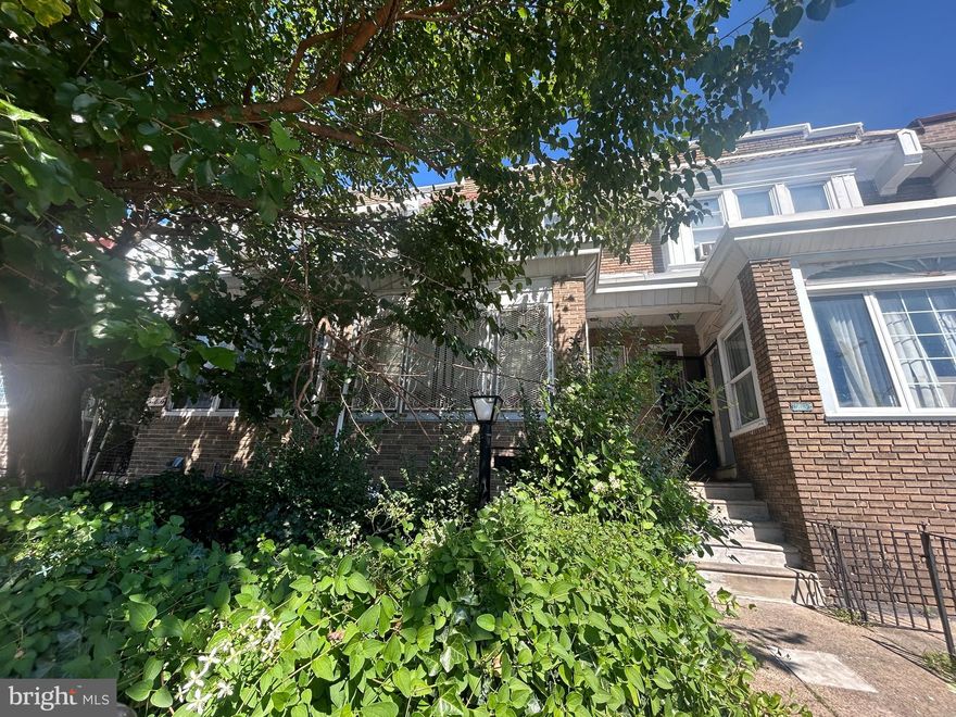 INVESTOR & OWNER-OCCUPANT OPPORTUNITY - CALL FOR  HIGHEST & BEST OFFER 
Investors and savvy owner-occupants, don't miss the opportunity to acquire this rare asset in a prime location just outside University City. Located on a quiet block, this estate townhome with attached garage + dedicated parking space (extremely rare in the city!) is ready to be SOLD. Perfect for fix-and-flip, BRRRR investors, or ambitious homeowners ready to create wealth through homeownership.  This TLC property features a solid structure with RM1 zoning that allows for conversion to multi-family use, opening the door to multiple income streams. It offers generous interior square footage with a straight-through layout perfect for easy open floor plan conversion, plus a partially finished basement with walk-out to the rear—adding even more functional space. The home includes unique features throughout: front patio, inside porch, large living room, large dining room, eat-in kitchen, shed kitchen with additional range, three bright and spacious bedrooms, and wide 3-piece bath with skylight. Walking distance to the Market-Frankford El and bus lines provides easy access to Center City, Delaware and Montgomery Counties, universities, hospitals, parks, schools, and shopping. For Investors: Strong rental potential with possible multi-family conversion for multiple income streams. Parking alone may command premium rents or additional income. Meanwhile, the spacious layout attracts families and higher-paying tenants—with comparable renovated properties selling for higher numbers as the area is rapidly developing. For Owner-Occupants: Build instant equity through strategic improvements with 203K financing while living in a prime location with rare parking and room to grow. Property sold strictly AS-IS, Cash or 203K only. Seller reviewing ALL offers—submit your highest and best by November 30, 2025.