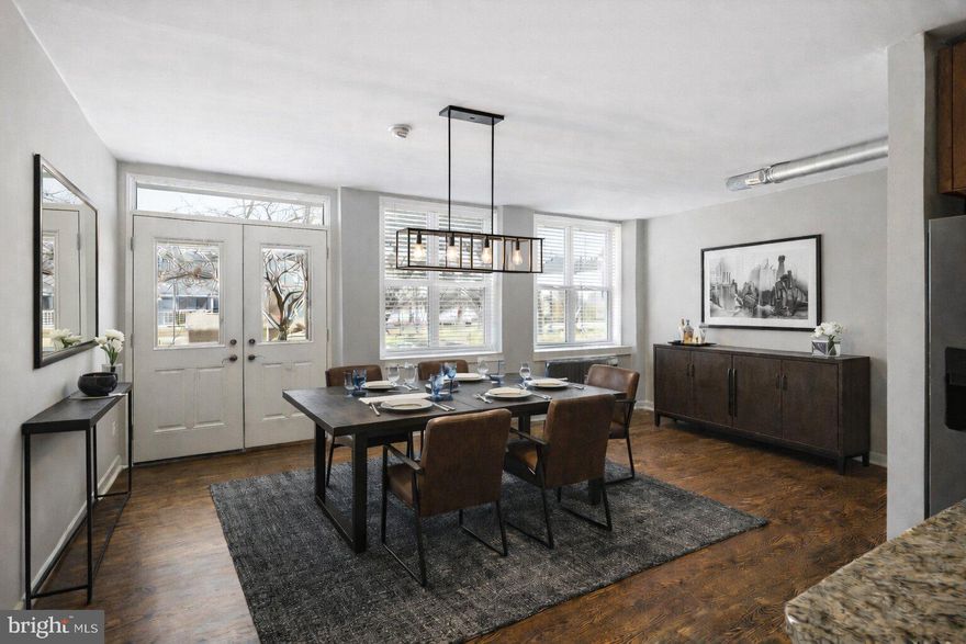 Perched on one of Old City’s most charming cobblestone blocks, this expansive one-bedroom residence offers over 1,375 square feet of character-filled living space in one of Philadelphia’s most historic and vibrant neighborhoods. Located on a quiet, tree-lined stretch of North Front Street just steps from the Delaware River waterfront, this home combines architectural character, generous proportions, and an unbeatable location.

Enter directly from the street into an impressive living space where wide-plank hardwood floors and tall windows fill the room with natural light while offering views of the surrounding historic streetscape. The expansive living area provides exceptional flexibility for both everyday living and entertaining. Just beyond, the well-appointed kitchen features granite countertops, stainless steel appliances, and a generous island that serves as the perfect centerpiece for cooking, dining, or gathering with friends.

A striking spiral staircase leads to the lower level, creating a dramatic architectural moment while opening to a versatile secondary living space. Anchored by a textured stone foundation wall, this level offers the perfect setting for a media room, den, creative studio, or home office, delivering a sense of privacy and retreat rarely found in city living.

The spacious primary bedroom feels like a true suite within the home, offering excellent closet space and a peaceful atmosphere tucked away from the main living areas. A crisp tiled bathroom with a full-size washer and dryer completes the residence, adding both comfort and everyday convenience.

Additional highlights include low monthly condo fees and a pet-friendly association, making ownership both practical and inviting.

From this exceptional Old City location, some of Philadelphia’s best dining, culture, and waterfront attractions are just moments away. Enjoy easy access to neighborhood favorites, local galleries, breweries, parks, and the Delaware River Trail, while historic landmarks, vibrant nightlife, and convenient public transit make this one of the most dynamic and walkable neighborhoods in the city.