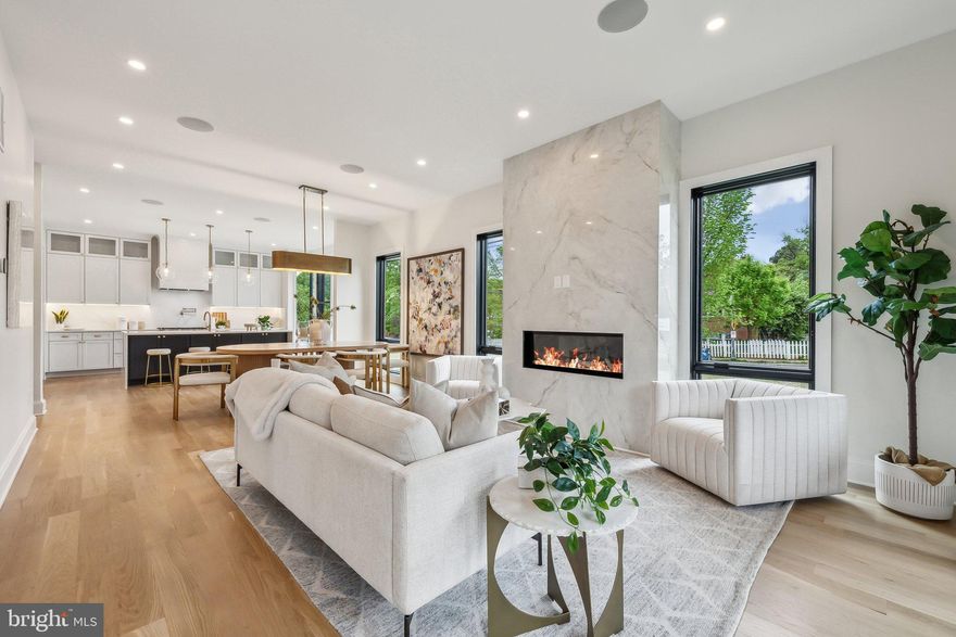 Modern Elegance in the Heart of Penrose – A Custom Masterpiece by William Andrew Homes

Welcome to your dream home—where bold modern architecture meets the warmth of timeless design in one of Arlington’s most cherished neighborhoods. Set on a beautifully landscaped corner lot in the vibrant and close-knit Penrose community, this brand-new custom residence offers a harmonious blend of luxury, comfort, and sophistication. Designed to impress from the very first glance, the home’s striking exterior features a bold black metal roof, crisp white façade, natural wood accents, and dramatic floor-to-ceiling windows that flood the interior with light.

Inside, a thoughtfully crafted open-concept layout spans multiple levels, creating spaces that are both cozy for everyday living and expansive for effortless entertaining. Elegant details abound—from wide-plank hardwood floors and designer lighting to refined architectural touches that elevate every corner. The heart of the home is a chef-worthy kitchen outfitted with premium Thermador appliances, custom cabinetry, and a show-stopping oversized island—perfect for gathering, cooking, and making memories.

Enjoy peaceful mornings on your private primary suite balcony or unwind in the lush, landscaped yard—with Penrose Park just beyond your back gate. This seamless connection between indoor and outdoor living enhances the overall sense of tranquility and flow throughout the home.

Tucked into a charming neighborhood with tree-lined streets, this location offers the best of both worlds: a peaceful residential setting with easy access to Clarendon, Columbia Pike, local parks, restaurants, and more. Whether you're grabbing coffee from a nearby café or commuting into DC, convenience is always at your doorstep.

Located within the Penrose Historic District, a neighborhood celebrated for its character and strong community spirit, this home offers not just a beautiful space—but a lifestyle rooted in connection and charm. Come experience it for yourself.