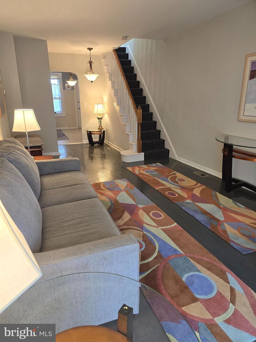 This circa 1917 townhouse has been brought into this century with a host of modern amenities. Central heat and air, Stainless appliances, tile bathrooms and  a very contemporary kitchen. Best of all over a period of time the former vegetable garden has been converted into a necessary parking pad.  A lower level walkout makes access to the parking pad easily accessible.  The upper levels of the home  feature wood floors, some covered with tasteful carpeting, while the lower level flooring is concrete. That level  also features a bonus room looking to be defined, and a laundry and storage area.  This house shows well. On Sentri Lock. Note! there are no signs posted on the property.