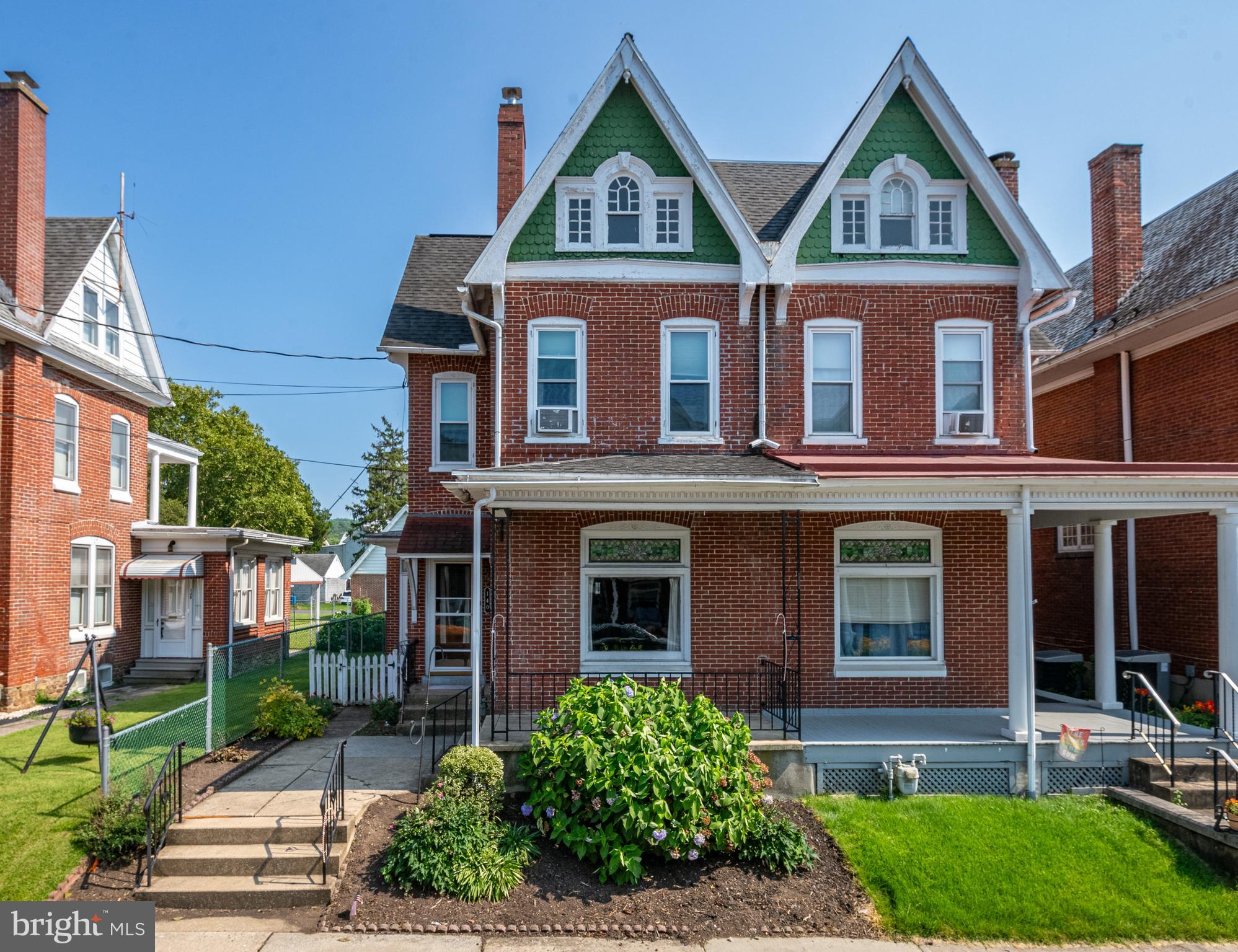 Beautiful Victorian style home is the perfect blend of historic elegance with modern conveniences. Featuring a stately brick exterior, stained glass windows, soaring ceilings that create a spacious, airy feel, original Oak floors, and intricate woodwork throughout every detail reflects the craftmanship and charm of a by-gone era. Inviting front porch, formal living room, family room, kitchen with granite countertops, tile backsplash, gas cooking, and dining room with built-in cabinets. A sunroom off the kitchen and dining area is the perfect spot to enjoy your morning coffee or to soak up the sun year-round. A convenient half bath on the main level is great for your guests. Upstairs the spacious primary bedroom offers double closets and access to a private balcony. Two additional bedrooms, one with a walk-in closet is located on the upper level. The third floor has a large fourth bedroom, that could easily serve as an office, studio, or bonus space. Covered back porch overlooks the fenced in backyard. All appliances are included along with the front loading washer and dryer. Full basement with plenty of storage space, an oversized one car detached garage and off street parking, newer windows, economical gas heat, this home has so much to offer. Located close to Fleetwood Park, and within walking distance of the middle and high school. Don’t miss out on the chance to make the charming home yours!
