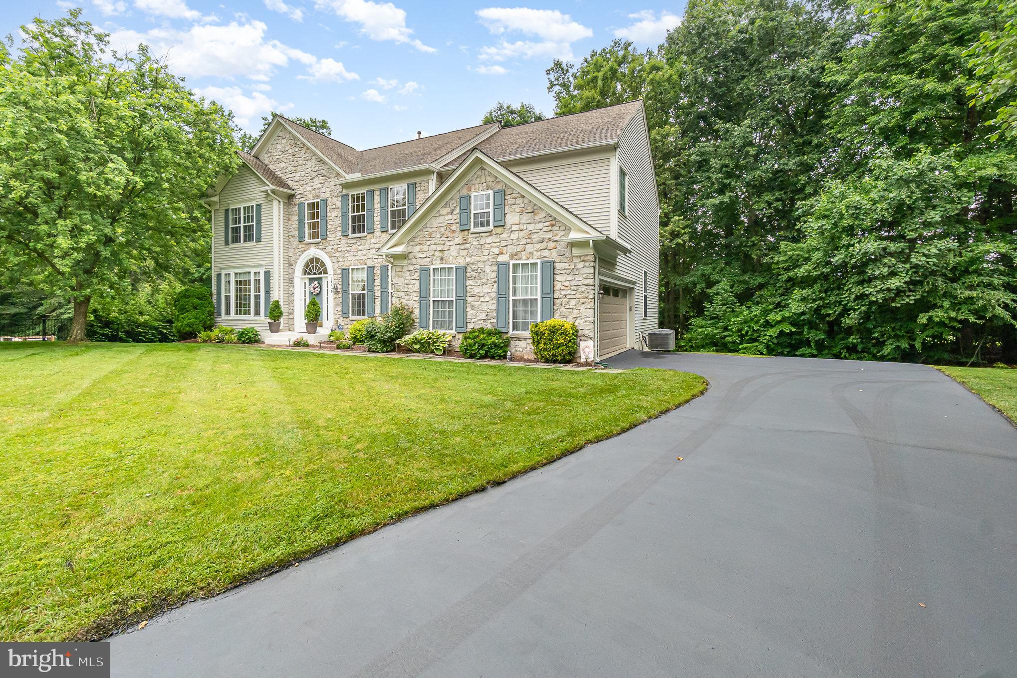 Welcome to this gorgeous 5 bedroom, 4.5 bath huge modern colonial with a two car garage in the highly sought after Vineyard Oaks neighborhood of Bel Air North. This home sits in a court in the rear of the neighborhood, has a large cleared rear and front yard and backs to forest for ultimate privacy. This house sits just a quarter mile from C Milton High School and Middle Schools and minutes from shopping, dining and the Bel Air Bypass. Sitting on half an acre lot, this home backs to woods which back to farmland, with a large cleared rear/side yard for tons of room for play and/or entertaining. Pull into the two car garage or Park on the parking pad. or driveway and take the walkway to the front door. Entering through the front door brings you to a double story foyer with wood floors spread out in front of you in ll directions. To the left is a large family room with wood flooring and bay windows, and to the right is a formal dining room with custom wainscoting, chair rail and crown molding to accent the wood flooring. The dining room feeds directly into the kitchen. A short hallway from the front door leads to two storied living room with a gas fireplace and custom trim throughout. Off to the left of the living room is an office with French doors and a convenient first floor powder room. Back in the living room, it opens up into a large gourmet kitchen. The kitchen has tile flooring throughout with a massive granite island, granite countertops, built in granite desk and large breakfast bar, pantry, all stainless appliances and tons of cabinetry. There is a second butlers staircase off of the kitchen to the second level and a beverage bar at the bottom of the staircase. The kitchen overlooks a bump out tiled sun room which is perfect for relaxing and soaking up the natural light. Sliders off of this sun room open out onto the double tiered rear deck which looks out over the large yard and forest beyond. Back inside a short hallway off of the kitchen leads to the two car garage, as well as a mudroom area and large laundry room with washer/dryer and wash sink.
To get to the second floor, the front wooden staircase takes you to a second floor landing that overlooks both the foyer and living room from either side. To the left of this hallway are two large bedrooms adjoined by a modern jack and Jill bath in between with a quartz double vanity and tub/shower combo. On the right side of this hallway is a bedroom with its own walk in closet and private modern bath with tub/shower combo. Lastly on this floor is a massive owners suite with its own gas fireplace, custom tray ceilings, a large 92sq ft walk in closet, and a huge private bath with a double vanity, soaking tub and walk in shower.
Taking the stairs to the basement brings you to a massive carpeted living area with endless room for entertaining, play or relaxation. There is a walkout with sliders leading to the backyard. Also, in this basement is a bedroom with its own walk in closet, and a full bath with walk in shower. There is also tons of storage down here as well, between a small room and the large unfinished storage/mechanical room. This gorgeous home has all the room you could need with a desirable open layout and one of the best lots in the neighborhood. Don't waste time, come see it today!