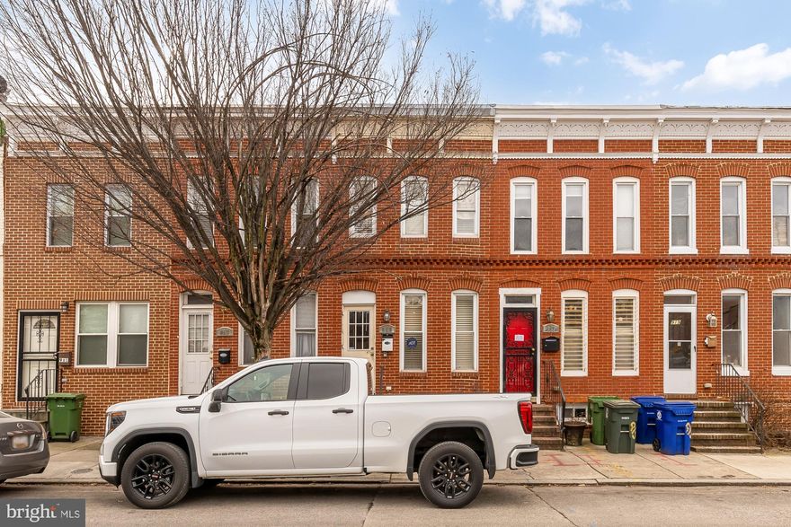 Stylish 2BD brick home with a double deck and off-street parking in one of Baltimore's most desired neighborhoods. This home features a wide-open floor plan with thoughtful upgrades throughout. Hardwood floors, crown molding, exposed brick, and custom trim add warmth and character, while the spacious kitchen shines with granite counters and stainless steel appliances. Upstairs, two generously-sized bedrooms share a renovated bath. The fully finished  lower level offers a large, flexible bonus living space, a dedicated laundry room, and a half bath. Outside, enjoy a double deck perfect for entertaining and the ultimate convenience of off-street parking. Recent updates include portion of the roof as well as the central HVAC system.  And this home is near EVERYTHING - from the Mystiqe Barrel Brewing across the street to tons of restaurants and coffee shops at your fingertips! With a 9.3 walk score and excellent transit options, this attractive, turnkey home offer tremendous value. Make it yours today!