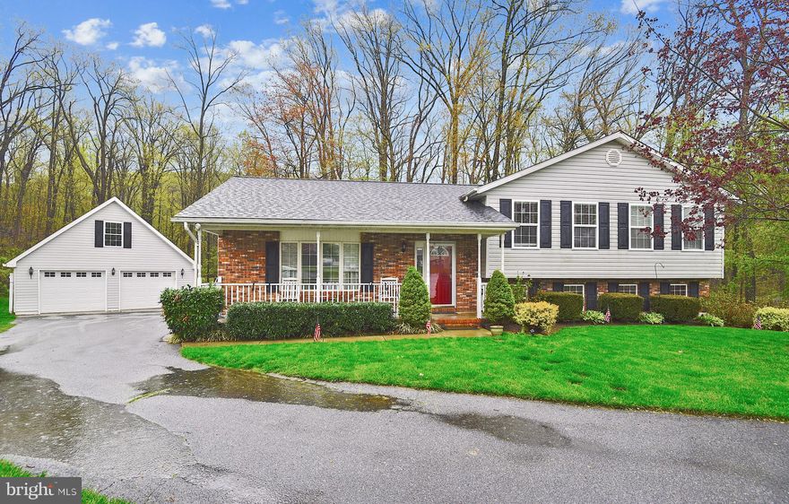 Spacious   4 level split with open floorplan offering  5 bedrooms , 4 full baths, hardwood flooring, granite kitchen, updated baths,fenced shaded private backyard and oversized garage that could park 4 cars!  Enter the front door into bright living room with wide open space to  kitchen.  Updated  a few years ago include  new white cabinets, granite island and counters and  stainless appliances.  Deck off the kitchen as well  a side door exit to the detached garage.   Second level master bedroom master bath ,  2 additional nice size bedrooms and hall bath.  Lower level 1 has family room,   2 bedrooms and full bath. Walkout from the family room.  Lower level 2 offers addtional family /game room , another ful bath, storage and laundry.  Located at the back of cul de sac this home  provides privacy with  a  shaded  fenced yard.  Well established neighborhood provides easy access to Rt 27, 140, 30 and Pa 94.  Within last few years  NEW 50 year shingle ROOF and HVAC .  3000+ Sq Ft finished and will not dissapoint!!