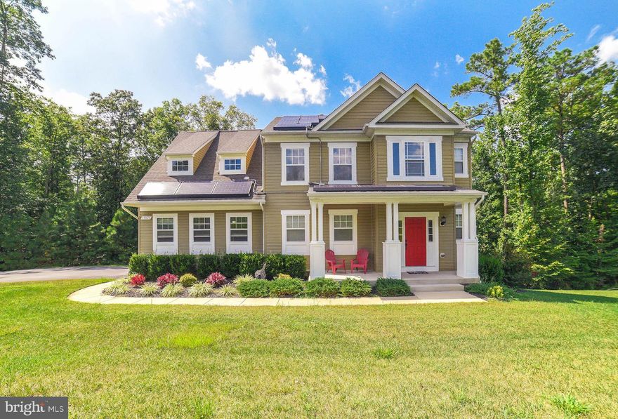 This beautiful home on 2 acres is move in ready. Open floor plan on the main level featuring living room with fireplace, dining area and airy upgraded kitchen with plenty of cabinets and counter space. Upper level features Master Suite with sitting area, walk=in closet and huge bath with soaking tub separate shower and separate vanities. 2 additional bedrooms and hall bath. Fully Finished basement feature full bath, family room and access to the cement patio. Additional features include screened porch, dark hardwood floors, attached 2 car garage, paved driveway and a 40 head programmable sprinkler system for maintaining the beautiful landscape.