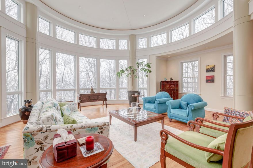 Stately home on most popular street in River Falls.A magnificent 2 story addition with Rotunda ceiling and clerestory windows provide magnificent views of trees and wonderful sunsets. This inviting home with its sun-drenched rooms provide comfortable and very generous entertaining space. The modern Kitchen leads to a Sun Room with walls of glass and scenic views. The adjacent Family room has custom library built-ins. The open floor plan leads to a large Den perfect for cozy moments ; a built-in sleek Bar welcomes guests for a drink before they settle down and relax in the Great Room taking in the wonderful scenery.  The magnificent Master Suite offers a custom built huge dressing room with custom built furniture for all your clothes. The renovated Master Bath features 2 vanities, large shower stall and separate tub as well as a heated floor. There are 3 additional Bedrooms and 2 more Baths on the second floor. The lower Level is perfect for work-out, play and the Artist Studio with heated floor invites your creativity. This home is one of the largest in this popular neighborhood and is a truly rare offering. RUN..DON'T WALK!