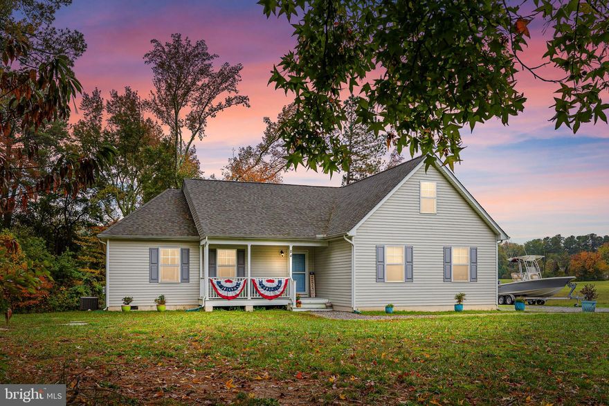 Gorgeous light-filled home with great open floor plan and cute front porch! Featuring tons of upgrades: beautiful cherry cabinets, granite counters, modern paint colors, waterproof luxury vinyl plank flooring, & stainless steel appliances. Walk-in closets in every bedroom! Huge hall bath and perfect separate, walk-in laundry room. Wonderful finished bonus room over garage gives even more space and is perfect for a home office, play room, craft room - whatever you need! Large deck overlooks the trees/views in the backyard.  A treasure of a home in the amenity-rich community of Cabin Point. High-speed Atlantic Broadband Internet!