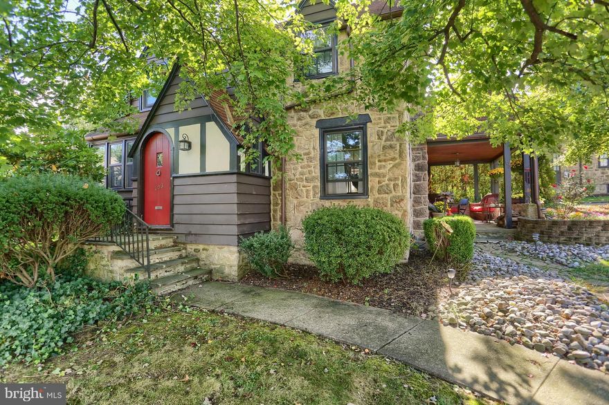 Absolutely adorable stone English Tudor in quaint and quiet borough of Mt. Penn.  Character and Charm Exude inside and out, with features that you don't see in today's homes.  From the cozy front porch you will enter into the living room, where you will find hardwood floors and a wood burning fireplace to enjoy cold winter nights.   Adjoining the living room is the spacious and bright dining room which then leads into a Fabulous 28 handle Gourmet Cherry Kitchen with vaulted ceilings and breakfast bar, with all appliances remaining, connecting to the  mudroom/pantry.  Perfectly located office/den/study/library/studio with chair rail. crown molding and wainscoting. Conveniently located on this level is also a powder room.    There are three nicely sized bedrooms on the 2nd floor all with hardwood floors and a full bath completes this level.  For all of your storage needs there is an attic and full basement.  Top of the line Pella windows, newer gutters and downspouts, new water heater, 4 yr old woodstove stove insert and much more.  You will be impressed with how lovingly this home has been cared for.  The current owner/artist has enjoyed every second of her time here and will miss it tremendously, but it is time for her to move on.  If you are looking for something that is not cookie cutter  you won't want to miss out on this one of a kind beauty!