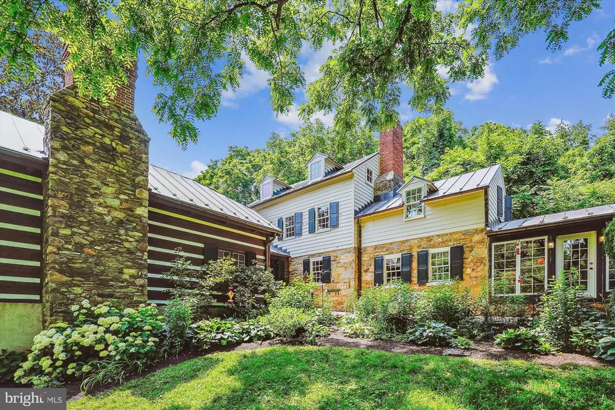 Historic Charm Meets Modern Comfort on Beaver Dam Creek
Chamblin Mill | Circa 1792

GUEST HOUSE INCOME:  separate guesthouse  with 1 bedrooms, study, full bath, family and dining room, fireplace, kitchen, full bath and full front porch..  Own entrance, utilities and driveway has produced substantial rental income. Private with views of creek. Great part time rental with VRBO or Airbnb.

Current loan is assumable at 2.75%.  Step into a rare blend of preserved history and contemporary comfort with Chamblin Mill, a historic treasure nestled on 3.21 picturesque acres with approximately 1,000 feet of pristine frontage on Beaver Dam Creek.

Originally built in 1792, this remarkable property was once a thriving grist mill and holds a meaningful place in American history. The mill itself was burned down during the Civil War, but the Miller’s home survived and remains a captivating part of the main residence today — offering the charm and craftsmanship of a time long past.

With over 4,700 square feet of total living space, the property features 4 bedrooms, 3.5 baths, and five wood-burning fireplaces, adding warmth and ambiance throughout the home. Thoughtful additions have enhanced the residence while preserving its historic soul.

The first of two extensions includes a three-car garage and a fully equipped one-level guesthouse with its own private entrance and utilities — featuring 1  bedroom,  Den/study , a full bath, kitchen, dining room, family room, and a welcoming full front porch. Perfect as an in-law suite, rental opportunity, or guest retreat.

The second extension to the main home adds even more functionality and space with a stunning stone foyer, half bath, additional family room, and a luxurious primary suite with full bath — offering privacy and comfort.

Outdoor amenities abound and include a peaceful dove house, expansive patio, rear porch, and an in-ground pool with spa — creating a serene retreat for both relaxation and entertainment.