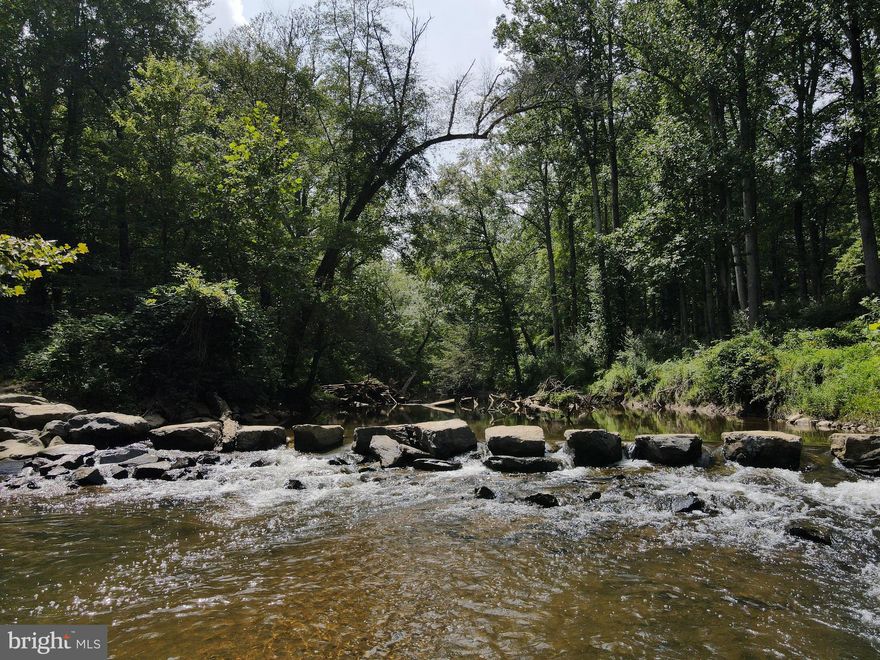 Welcome to 9105 Mill Pond Valley Drive. A magnificent two and a half acre, water-front property on Difficult Run River and also the homesite to your future, custom, 7,000+sqft LEED-Certified, High Energy Efficient/Healthy home. Nestled on the cusp of Great Falls National Park, this property will offer breathtaking views of Difficult Run from the floor to ceiling windows that will expand across the rear of your home. Virginia Luxury Homes is one of the only 1% of builders in the United States that are able to build a large, luxurious, LEED-Certified home. Using only high-end materials and Green components in our builds, our team of artisans will provide only the highest level of workmanship in building healthier, value engineered, homes at cost competitive prices. Our LEED and and Energy-Star certification standards throughout the entire build process will assure you that you will own a home with far greater quality and build standards than a traditionally built home.  From our Design Selection Specialist to our Project Manager who is on-site every day throughout the build, you will work hand-in-hand with our experienced Team of experts to build your dream home on this one of a kind parcel of property in the heart of McLean. Fabulously located just 1.4 miles to 800 acres of Great Falls National Park; 5.4 miles to Tysons Corner Center and the Silver Line Station for Metro; 9 miles to Reston Town Center; 14 miles to Dulles International Airport; 19 miles to our Nation's capital and DCA Airport.  See our documents section for a list of standard features that will be included in your custom LEED-Certified Home.