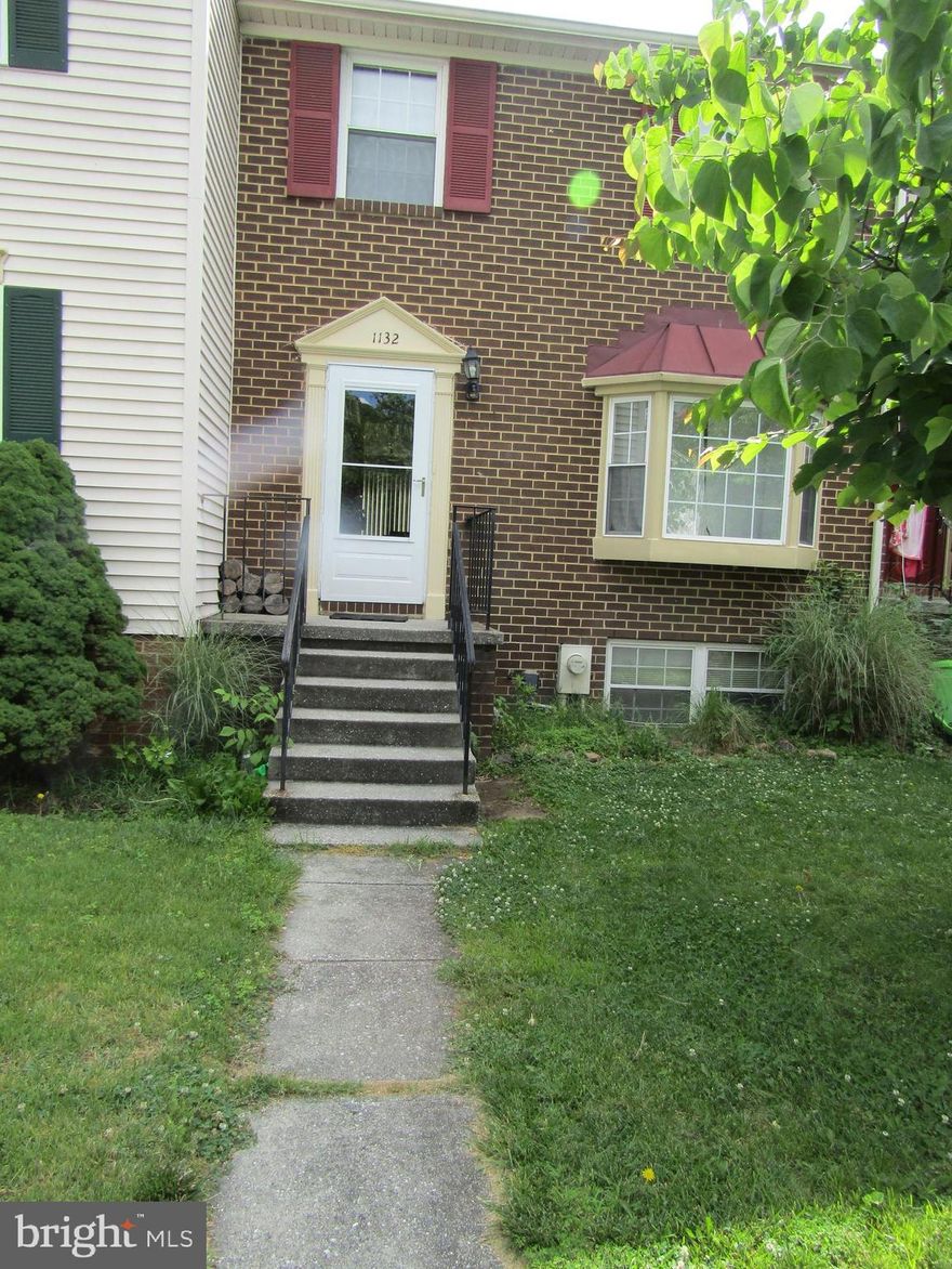 Three bedroom townhome ideally located in the water-privileged community of Elizabeth Landing.   Formal living room, separate dining room and galley kitchen with stainless steel appliances, including built-in microwave and dishwasher.  New refrigerator with ice maker (only one month old).  Upper level has three bedrooms and one bath, lower level rec room, currently being used as additional bedroom.  Wood burning fireplace adds to this area.   Updates include HVAC replacement in 2011. Rear yard is fenced with deck for outdoor seating.. HOA fees cover trash and water bill.