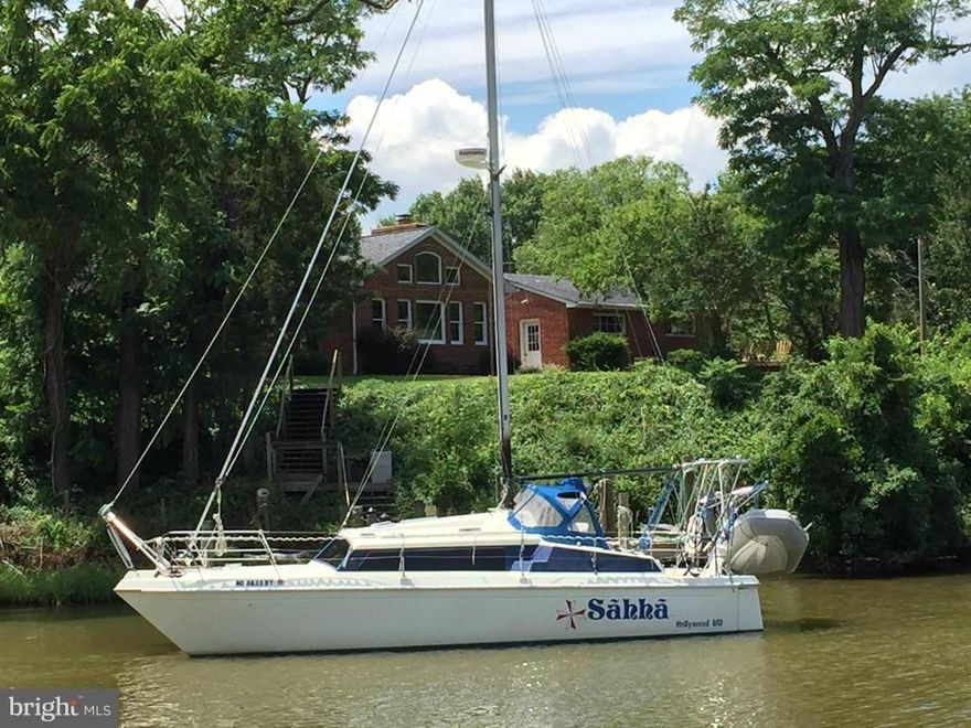 Waterfront in Hollywood!  Lovely, well-maintained, updated brick cape cod on 1.29 ac.  3BR's, 2BA's with partially finished (dry) basement & pier. Detached oversized 2-car garage & separate shed.  Extensive & attractive landscaping both in back & front of house. Light & airy family room with palladian windows & beautiful views of the creek & pier. No flood insurance req'd. Very motivated Sellers!