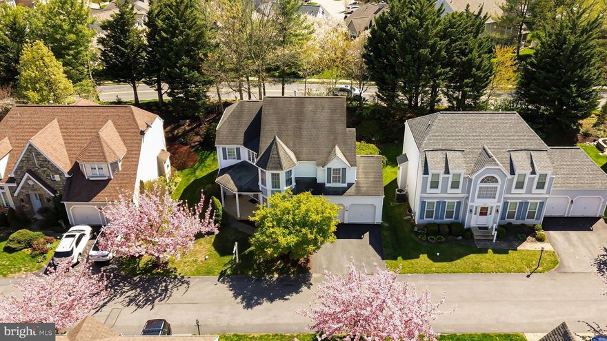 This stunning Victorian single-family home offers a perfect blend of classic charm and modern comfort in the highly sought-after Worman’s Mill community. With three spacious bedrooms and two and a half baths, the home welcomes you with a grand two-story foyer featuring beautiful oak hardwood floors. Flanked by a formal living room and dining room, the entry sets an elegant tone, highlighted by recessed lighting in the dining area and a bay window in the living room that fills the space with natural light. Hardwood flooring continues throughout the main level, creating a warm and cohesive feel. At the heart of the home is a gourmet island kitchen designed for both everyday living and entertaining. It boasts custom cabinetry, black stainless steel appliances, granite countertops, and recessed lighting, with French doors providing easy access to the backyard. The adjacent family room is truly a showstopper, featuring soaring ceilings and two stories of windows that flood the space with sunlight. A convenient main-level laundry room with a full-size washer and dryer, extra storage, and a half bath adds to the home’s functionality. Upstairs, the open hallway overlooks the impressive family room below, enhancing the home’s airy layout. The owner’s suite is a luxurious retreat, complete with a massive walk-in closet, heated floors, and a spa-like private bath featuring a jetted soaking tub for two, separate shower, and dual vanities with marble counters. New carpeting adds a fresh touch to the bedroom. Two additional bedrooms with ample closet space and a well-appointed hall bath complete the upper level. The lower level offers a finished gym room, perfect for staying active at home, along with abundant unfinished storage space. Outside, enjoy the oversized two-car garage and a welcoming covered front porch. Residents of Worman’s Mill benefit from exceptional community amenities, including a pool, recreation center, sidewalks, and streetlights. With easy access to major highways and proximity to shopping, dining, and everyday conveniences, this home offers both comfort and convenience in an ideal location.