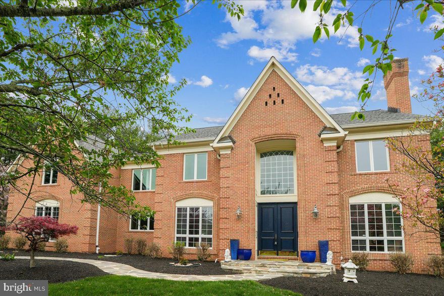 EXQUISITE AND ELEGANT POTOMAC ESTATE!
This quintessential all brick colonial is a palatial  beauty featuring 4 BR 4.5 BA  and over 5000 sq ft of living space in a serene Potomac setting steps from River Road! This exquisitely updated beautiful all brick home with side loading 3 car garage, level 2 acre lot, mature trees throughout on charming cul de sac of only five homes has had all major big ticket items redone - new roof (2019), gutters (2021), windows (2018/2024), fantastic newly finished basement (2019), hot water heater (2022) gutters (2021), water softener system (2019) and more.  
Follow the paved walkway into a soaring double entryway with Palladian windows gracing the front of the home, with tile entryway and curving staircase. On the right, ready to entertain in a formal living room with wood burning fireplace, crown molding, and recessed lighting.  A classic office and library in the back with recessed lighting enters into a sunken family room with soaring ceilings and wood burning fireplace with majestic two story stone chimney. Formal dining room in the front with classic wainscotting and elegant crown molding and crystal chandelier, and powder room discreetly tucked away under the stairs. The gourmet kitchen is all updated with eat-in breakfast nook featuring granite countertops, wet bar, wine cooler, and more overlooking the deck and backyard. Kitchen upgraded throughout, with all new appliances and a full remodel in 2015 including double wall oven, spacious pantry, electric cooktop with KitchenAid range, granite countertops and red quartz kitchen island.  Laundry room with extra closets and tile floor leads to a three car garage with shelving and built-in cabinets. The expansive outdoor deck is made of maintenance free composite, and the spacious level back yard will be the site of many family gatherings and entertaining for years to come!
Upstairs, the owner’s suite could be its own wing - vaulted ceilings, hardwood floors, separate sitting room, his and hers walk in closets flanking a dedicated dressing area and a separate ensuite private study. Pamper yourself in the renovated ensuite bath (2011) with walk-up soaking Jacuzzi bathtub, skylights, double vanity and walk-in shower. Bedroom two with double closets, and full bathroom with bathtub. Bedrooms three and four share a bathroom with Jack-and-Jill entryway with skylights, dual vanities, bathtub, and tile flooring.
Basement (completely redone 2019) is a wonderland of family entertaining with full kitchenette, redone in gray granite and red and yellow tile backsplash and white cabinets, with a bar area and composite flooring throughout. Tile wall detail is one of many designer touches in this fun and multipurpose space! In addition, you’ll find a bespoke Japanese room,another wood burning fireplace with brick hearth, extra closet spaces, and billiard/ping pong table (conveys) for family game nights. Every corner has something fun for the family to do! Completely remodeled full bathroom in basement with white marble tile detail and walk in shower complete this space.
This home has been impeccably maintained and upgraded by the original owners, and from top to bottom it is a generational treasure, with space for everyone to enjoy gathering both indoors and outdoors for many years to come. Summer under the stars in the tranquil backyard, and gather together inside when the weather turns cold around the stone fireplace and enjoy the best of living in this luxurious enclave. Located minutes from Potomac Village, Bretton Woods Country Club, shopping at Kentlands and Rio, and all major commuting corridors - welcome home to 12640 Travilah Road.