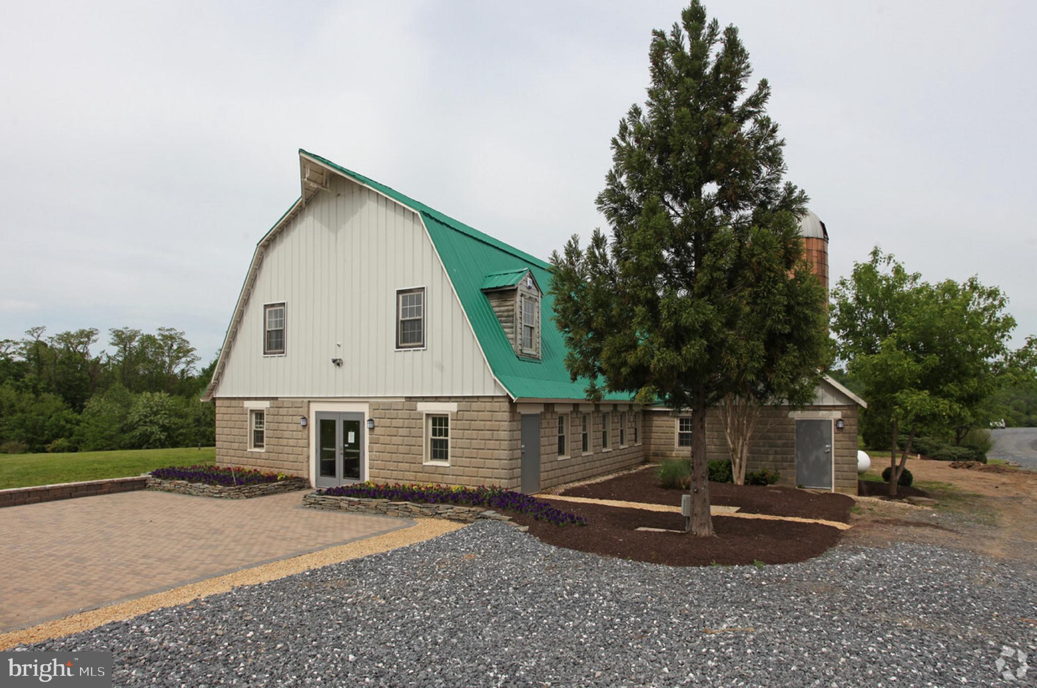 Prime opportunity to lease this 22-acre parcel featuring several improvements. Nestled within the thriving 355 growth corridor, this Industrial facility features a converted barn with 6,800 SF of office space, a 5,600 SF warehouse Mechanic Shop, a 6, 600 SF Pole Barn, and completely fenced storage yard. Give us a call today to schedule your private showing of this one-of-a-kind property. Offered at $28,000 NNN.
