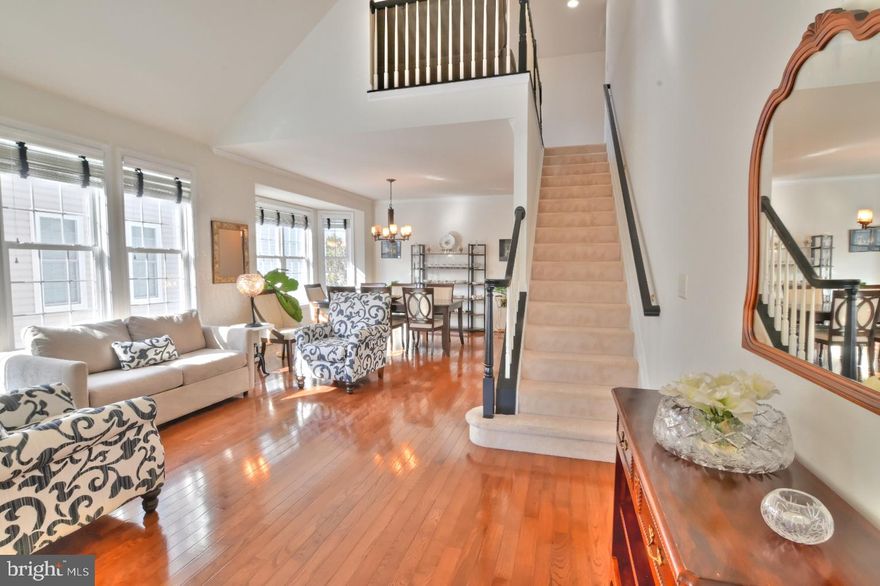 Welcome to this elegant and beautifully maintained home located in the Award-Winning Heritage Hunt 55+ Golf & Country Club Community.  As featured in HAVEN | Homes + Lifestyles Luxury Magazine, this home offers over 4,500 square feet of living space and provides a bright, light-filled atmosphere with a welcoming sense of warmth from the moment you step inside. The home flows effortlessly beginning with the sun-filled living room and elegant dining room highlighted by a bay window, chair rail and crown molding, creating an inviting and comfortable layout. A private office just off the entry is ideal for working from home or quiet reading. 

The chef’s kitchen is thoughtfully designed with custom-designed full-height backsplash and an abundant amount of cabinetry and storage.  The expansive peninsula offers generous prep space and comfortable breakfast bar with plenty of seating.  The kitchen opens seamlessly to the family room with a gas fireplace, an ideal setting for everyday living and gathering.  Spectacular hardwood floors flow seamlessly throughout the main level, adding both warmth and elegance. 

The main-level primary suite is generously sized to accommodate a sitting area and designed as a true retreat. A large walk-in closet provides ample storage while the en-suite bath features dual vanities, a soaking tub and separate shower.  A second bedroom, full bath, two linen closets and a laundry room with large-capacity washer and dryer, overhead cabinets and direct access to the two-car garage complete the main level. 

The upper level offers a bright open loft providing a secondary living area ideal for guests or relaxation, along with a large third bedroom, full bath and linen closet. The unfinished walk-out basement offers excellent storage and rough-in plumbing ready to be customized to suit your needs and vision. 

Outdoor living is truly special with a spacious  three-season screened-in porch, perfect for morning coffee or relaxing evenings backing to peaceful common area and mature trees.  Vaulted wood-beamed ceiling, ceiling fan and stairs leading down to a spacious and inviting decorative concrete patio. Updates include: HVAC 2022, Water Heater 2019, Air Humidifier 2022, Screened Porch 2022 and Patio 2022.

Heritage Hunt amenities include 18-hole championship golf course, two club houses, restaurant and bar, indoor and outdoor swimming pools, two-story fitness center, tennis and pickleball courts,  a library, walking paths, and more. Convenient to retail/restaurants, wineries, I-66 and Bull Run Mountains Natural Area Preserve.   This exceptional home is the perfect blend of comfort, elegance and resort-style living in one of Northern Virginia’s most amenity-rich, sought-after 55+ communities.