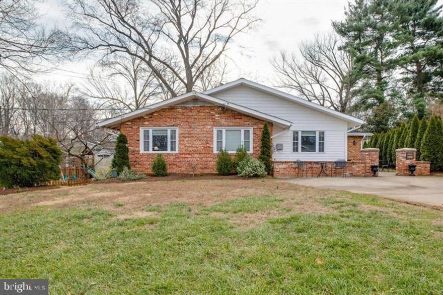 Beautifully expanded 4 BR, 3 Full Bath  home with Master in-suite, large addition- family room, 2 fireplace, renovated gourmet kitchen with / stainless steel appliances, granite, island & pantry, Hardwood floors. Upper level approx. 2100 sq & basement  with  1300 sq fully finished walk-out with full bath.  EZ access to 50/123/29/495/66, GMU, bus to metro.