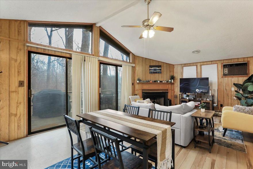 Welcome to 20 Shawnee Trail, a charming and private two-bedroom, one-bath cottage nestled on a beautifully wooded lot in The Woods Resort—well suited as a primary residence, weekend retreat, or income-producing short-term rental. Surrounded by nature and wildlife, this home offers a peaceful escape while still delivering strong lifestyle and investment appeal.
Inside, the cozy great room features vaulted ceilings, a wood burning fireplace, and two sliding glass doors that open to the 20x8 open deck, creating a seamless indoor-outdoor flow. It’s the perfect spot to enjoy your morning coffee or unwind after a day of resort activities. Furniture and hot tub are negotiable, offering added convenience for buyers looking for a turnkey option.
Owners have the opportunity to enjoy The Woods Resort clubhouse amenities, with memberships available at an additional cost. Amenities include two golf courses (Mountain View & Stony Lick), swimming pools, tennis courts, fitness facilities, scenic hiking trails, clubhouse dining, and the Sleepy Creek Spa.
Whether you’re seeking a low-maintenance full-time home, a relaxing mountain getaway, or a property positioned for short-term rental use, 20 Shawnee Trail offers privacy, charm, and resort-style living in one of the Eastern Panhandle’s most established communities.