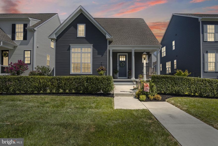 Welcome to your next chapter in the heart of the Arcona community. This stylish 3-bedroom, 2.5-bathroom home offers 1,927 square feet of thoughtfully crafted living space, built in 2022 with attention to both comfort and design.
Step through the front door into a spacious foyer that opens into a bright and airy layout. The main living area flows effortlessly between the kitchen, dining, and family room, creating a perfect setting for everyday living and entertaining. Recessed lighting and rich wood flooring add warmth and elegance throughout.
The kitchen is designed to impress, featuring white shaker cabinetry, sleek countertops, stainless steel appliances, and a central island that invites conversation and connection. The primary suite is a peaceful retreat, filled with natural light from oversized windows and offering a private space to unwind.
Enjoy evenings by the gas fireplace or spend time outdoors on the stamped concrete patio—ideal for relaxing or hosting friends. The large front porch offers calming views of the nearby park and greenbelt, making it a perfect spot for morning coffee or quiet reflection.
Living in Arcona means access to scenic walking trails, neighborhood parks, and a community pool just steps away. A full basement and two-car garage provide extra space and convenience, rounding out a home that’s as functional as it is inviting.