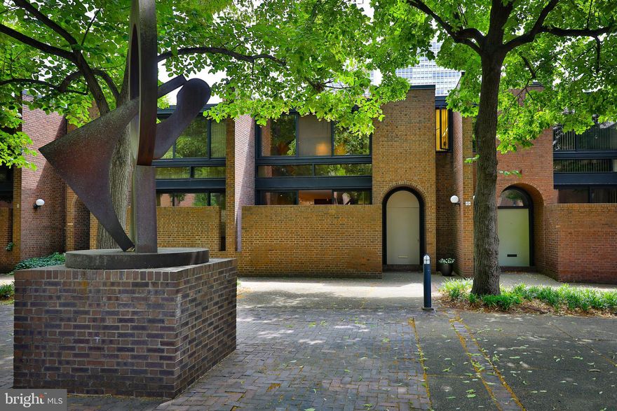 Calling all lovers of mid-century modern design and lifestyle, this is a rare opportunity to own a stunning, architecturally significant townhome with parking in Bingham Court, a park-like setting in the heart of Society Hill. Designed by I.M. Pei, best known for the Louvre in Paris, among many other iconic designs, this home has been lovingly restored and improved upon for over twenty years by the architect-owners. Located on a generous green courtyard along the quiet pedestrian walkways of Society Hill, this townhome offers the best of both worlds–a private sanctuary nestled gracefully into the heart of urban living.  It  has been featured in the Wall Street Journal (2022) and NBC News (2024) - and when you arrive, you will understand why. Once inside, you will be struck by the abundance of natural light and lovely views from extra large double windows in every room. High ceilings, custom built-in millwork in the mid-century modern tradition, front and back patios, and wood-burning fireplace, are just a few of the features that make this home so special. The eat-in kitchen features  an abundance of custom-made cabinetry with careful attention to every detail. The upper level hosts the generous primary bedroom suite which overlooks the courtyard and includes ensuite bathroom and spacious walk-in closet. Two additional bedrooms and hallway bathroom complete this floor. A full-sized lower level offers a variety of options for the next owner to add more finished living space if they desire. This home is just steps from countless wonderful restaurants, the Arden and Ritz theaters, unique shops and boutiques, ample public transportation, Headhouse Farmers Market, grocery stores, Washington Square, Three Bears Park, and many of the most beautiful and famous historic sites in all of Philadelphia. You really never have to use a car, though you will have your own convenient parking spot in an adjacent private lot. Offering a rare mix of townhome living along with some of the advantages that attract people to condo living, Bingham Court is a close community of 27 townhomes with a minimal HOA fee for maintaining the communal gardens, general upkeep, and snow removal - so you can sit back, relax, and enjoy your idyllic retreat in the city. These homes rarely come on the market, so don't miss the chance to call this special place your own!