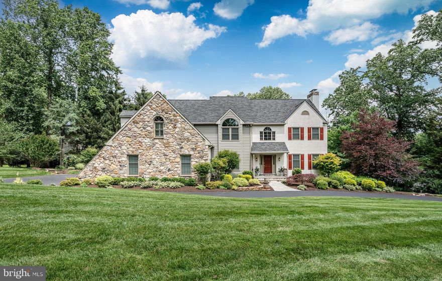 Welcome to 1217 Tullamore Circle located in the heart of the historic and tranquil hills of Chester Springs. This regal estate has it all! From its original high-end construction to the intelligent, no-expense-spared upgrades crafted consistently over the past 31 years. Tullamore Circle is a private cul de sac enclave of estates. 1217 commands its curb appeal with a sweeping half circle driveway, abundant garden beds and a prominent architectural stone accent wall. Backing to over 3 acres of woodland, down the country road from 112-acre Binky Lee Preserve and securely situated in prestigious Downingtown East and STEM Academy School District, 1217 Tullamore Circle truly delivers on Location, Location, Location! Go on an enticing journey by way of perfect bluestone walkways, past natural stone walls and garden beds until you come upon the 3-tiered stone koi ponds in the back of the home. Each with a waterfall leading from one to the next creating the most serene natural soundtrack of flowing crystal clear water. Welcome home as you make your way into the grand 2-story foyer with breathtaking modern chandelier (motor operated lift). 9-foot ceilings with rivers of crown molding and sprawling spaces flow throughout the main level. Prepare your family meals in style in the impressive gourmet kitchen, boasting newer stainless-steel appliances, an immense granite center island with prep sink, a plethora of custom cabinetry, walk-in pantry and workstation. Step down to the expansive family room with a show-stopping floor-to-ceiling fieldstone fireplace (which matches the fieldstone covering the exterior accent wall), a custom media wall and an incredible vaulted wood ceiling. For the Piece de Resistance, an extraordinary 2-story original mural painting of one of the largest waterfalls in the world; Victoria Falls in Africa! Off the open eat-in kitchen is your sunroom with skylights and views of the gardens and ponds. Expand your living space even further and fully take in your back yard oasis on your huge walk-down deck with custom awning. A formal dining room with a fireplace, art deco crystal chandelier and tray ceiling will be sure to impress even the most discerning dinner guests. A formal parlor with fireplace, home office with double French doors, Butler's Pantry, large coat closet, over-sized powder room, laundry room with built-in cabinets, stone floor & sink and custom drying racks completes the main level. Moving to the upper-level, the primary bedroom suite is truly an incredible arrangement of spaces to both begin and end your day in. Double door entry into your sitting/tearoom with bold feature window, go through to your grand bedroom with tray ceiling, custom window valances, 2 large walk-in closets, custom media wall, separate vanity space with mirrored-door 3rd closet, and your own private sunset-facing balcony and awning. Your vaulted ceiling bathroom is outfitted with an air-jetted spa tub, 2 chandeliers, walk-in stone and glass shower and double sinks. All bedrooms are equipped with large closets and big windows, and the middle room has a door leading to a staircase walk-up attic. The 3rd floor provides a wide open storage space with built-ins! A 2nd staircase to the main level is perfect not only for ease of moving around your home but also for providing an immersive art experience as you may seemingly descend Victoria Falls for yourself! The walk-out lower-level is a 100% footprint (TOTALLING 6,300. SQ.FT. OF LIVING SPACE) and is equipped to entertain you and your guests with a lounge area and Vermont wood stove, encourage you with a hobby room, motivate you with a gym space and keep you productive with a workshop. Further extending out onto a beautiful, shaded bluestone patio. The finished 3-car garage has LiftMaster silent, soft-close doors.
