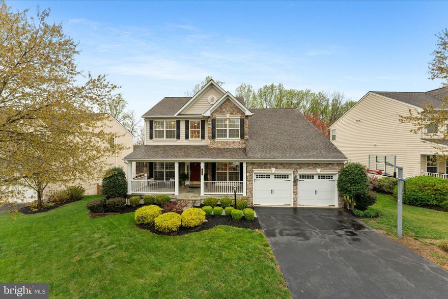 Welcome to Old Dominion Valley, where this home stands out with its stone front,  gorgeous front porch, and meticulously landscaped yard.   The backyard steals the show with its gorgeous stone fireplace, flagstone patio, and premium fenced lot that backs to mature trees.  Perfect for entertaining!  This stunning home features 4 bedrooms, 3.5 baths, and an open floor plan. The main level has hardwood flooring throughout and has been freshly painted.   The living room has two-piece crown molding, and the dining room has a coffered ceiling and shadowboxing.  The floor-to-ceiling gas stone fireplace is the centerpiece of the family room, along with recessed lights.  The kitchen has cherry cabinets, an island, a pantry, and subway tile. An office overlooks the gorgeous backyard.  Upstairs, the primary suite features vaulted ceilings, his/her walk-in closets, and an en-suite bathroom that has been nicely updated with dual vanities, a soaking tub, and a frameless shower door. Three nicely sized bedrooms and a full bath complete the upper level.  The walk-out lower level is designed for entertaining with luxury vinyl plank, recessed lighting, a full bath, and a wetbar.  Plus, a bonus room that can be used as a playroom for kids, a second office, or a bedroom. Nestled in the heart of Purcellville,  you are minutes away from schools, shopping, and endless wineries and breweries, Fireman's Field, and Franklin Park.  In addition, the renowned  W&OD trail is in your backyard. Updates include a new roof (2024),, washer/dryer (2025), and HVAC (2016).  This move-in-ready home truly has it all.