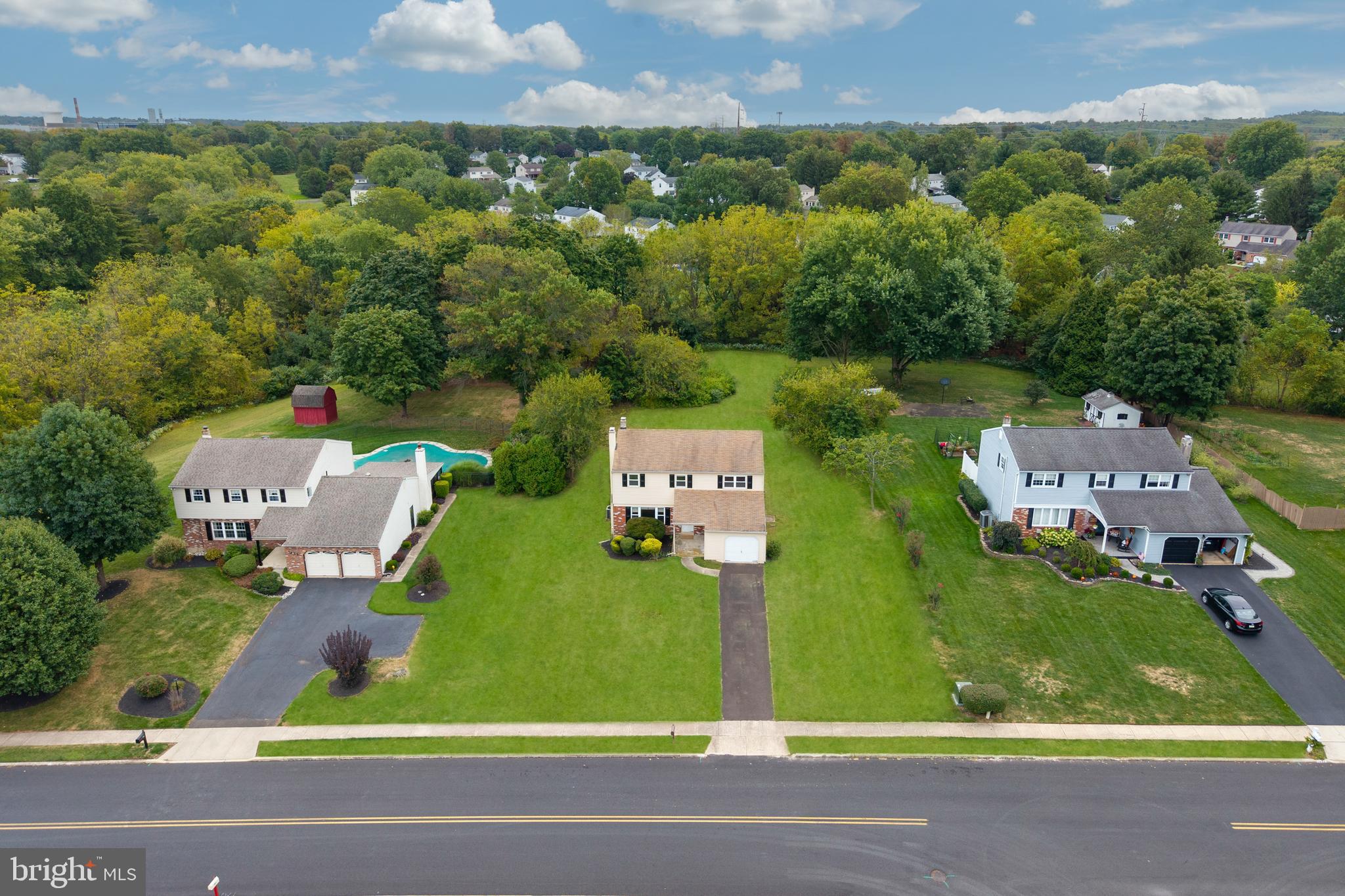 Welcome to 1959 Supplee Road, set on a great lot in the heart of the ever-popular Sugar Valley neighborhood. Out back, you’ll find open township-maintained land, which gives you the sense of extra space without the upkeep. The location is a win too: you can walk to Gwynedd Square Elementary, the neighborhood playground, and even Merck.
Step onto the covered front porch and into a bright foyer that opens to a large living room centered by a classic brick fireplace. The eat-in kitchen sits straight ahead, with the dining room on one side and the family room on the other. The family room opens to the backyard through a sliding glass door, giving you easy access to a wide, flat yard.
Off the family room, you’ll also find a powder room, laundry with side-yard access, and entry to the garage. Upstairs are four well-sized bedrooms and two full bathrooms. The primary suite has its own bath and a walk-in closet with plenty of usable space.
The basement provides abundant storage or gym potential, and thanks to its higher ceilings, it’s also a strong candidate for finishing if you’d like more living area.
Come see it in person at one of our open houses.