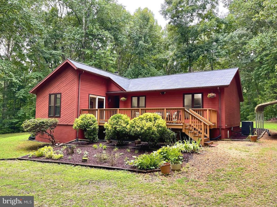 Beautiful private setting on 1.38 Acres in the Hartwood District of South Stafford County.  Located 15 min from I-95 and Commuter lot from Exit 133/RT17 N-WARRENTON Rd.   MOUNTAINVIEW HS/GAYLE MS/HARTWOOD ES.   **NEW** CARPET 2024 LIGHT FIXTURES 2024 HVAC 2022 ROOF & GUTTERS 2021 COND. CRAWL 2022 BOTH DECKS 2019  EXTERIOR PAINT&WOOD PROTECTING (2019) 2024   Take a moment and view all photos and walk-thru video. The Entrance to this amazing mid century Ranch home begins with the tree lined driveway that turns into a circular drive, allowing for easy in and out access. There is plenty of parking to include a two car carport.   FRESHLY PAINTED INSIDE & OUT! ALL CLOSETS are Cedar lined for freshness and longevity of your items. Primary offers large windows to view your garden oasis, spacious walk-in cedar lined closet with wooden (no wire) shelving.  All bedrooms are very spacious and offer lots of closet space, freshly painted ceilings, walls and trims, new carpet&padding.  The KITCHEN is truly the heart of the home with its 8’x4’ granite island that has cabinets galore in both sides providing pull out dovetailed shelving, it’s just beautiful and is a chefs dream for sure.  Brand new 12”x3” Dalitile backsplash brings brightness and charm to this already lovely kitchen/dining combo space.  Not only does it boast 3 large windows bringing in the gorgeous outdoor views but it also provides one of two high end sliding doors that fully open to the massive deck.  The end all of charm IS the Family/Living Room with its vaulted ceilings, wood beams and wood paneled ceiling that cascades down the main wall that features a brick and wood front Fireplace with slate hearth and large built-ins. Due to the design, this room can be staged how ever you like because of the two large wall areas. Again, there is another upscale sliding door that smoothly opens to your (2019 built) large deck that looks over the spacious garden and back yard that houses a 12’x20’ matching shed for extra storage space and lawn equipment.  This lovely home is move in condition with plenty of options for a buyer to put their own creative touches too.   COME AND MAKE THIS WINSLOW HEIGHTS RANCH YOUR NEXT HOME!!