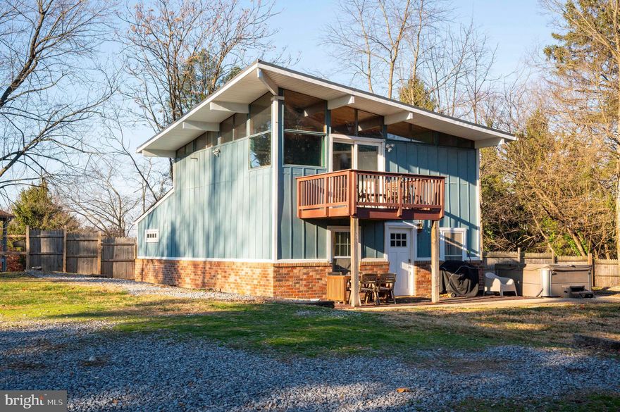 Unique and adorable, modern rustic interior with contemporary single pitch roof exterior, you won't forget seeing this home.  Privately set atop a hill on a level lot with a six foot privacy fence and outbuilding - with .6+ acres there's plenty of space for all the toys.  The updated and renovated interior features an open main floor with laminate flooring, an entry level bedroom and a full bathroom and laundry.  Upstairs is a stunning primary bedroom with a personal balcony, walk-in closet, and en suite bathroom, plus an additional bedroom with large closet.  Outside, the wraparound patio makes great entertainment space, and the cleared lot is ideal for gardening.  Community river access is provided.  Move-in ready, mountain living with cable internet.  OFFER DEADLINE HAS BEEN SET FOR TUESDAY 12/10 AT 6PM