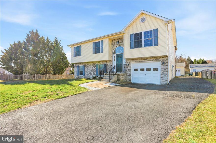 This split foyer home in Cameron Acres offers a blend of comfort and functionality. Built in 2005, it features a partially finished daylight basement with garage access, providing ample storage and potential for customization. The interior boasts a combination kitchen/dining area, a family room off the kitchen, and convenient walk-in closet in the primary bedroom. Enjoy modern appliances including a dishwasher, microwave, and electric range/oven as well as a water softner system for added convenience. The exterior is equally appealing, with an outbuilding for additional storage, 2 car detached garage, and a 12' x 16' covered deck for outdoor relaxation.  Architectural shingle roof, vinyl siding and HVAC system all replaced in 2018 along with a new hot water heater just over two years ago!  Parking is a breeze with an attached one car garage and two car  detached garage, complemented by an asphalt driveway. Located in a vibrant community, residents benefit from nearby parks, schools, and essential public services, making this property a perfect choice for those seeking a welcoming neighborhood atmosphere. Experience the best of suburban living in this delightful home!