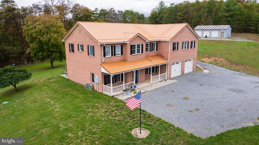 Welcome to 373 Whissen Lane in Berkeley Springs! This spacious 5-bedroom home offers 3,708 sq. ft. of living space on nearly 3 acres. The main floor features a primary bedroom and bath, hardwood floors in the kitchen, dining, and living room, granite countertops, and beautifully tiled showers. A 1,000 sq. ft. bar and lounge area provides the perfect space for entertaining or could be converted into additional rooms or living areas. Outside, enjoy plenty of patio and poolside space for gatherings, plus your own basketball court for fun and recreation. The property also includes an attached 2-car garage and a detached 3-car garage with room for vehicles, storage, or hobbies. Located just minutes from downtown Berkeley Springs, this home offers the perfect blend of space, comfort, and convenience. Schedule your showing today!