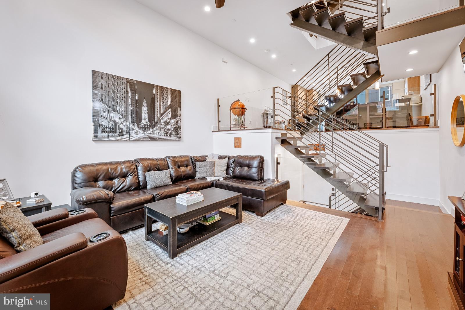 **Available 9/1/24**Welcome to 1333 S Garnet Street, in the Smith School Townhomes development in vibrant Point Breeze. This sprawling luxury property features 3 bedrooms, 2 full baths, and 2 half baths, with a private garage and gated parking,   You enter into a  grand living room, with 13-foot ceilings, with an abundance of natural light. Below lies an expansive fully finished basement with a convenient half bath, offering versatility for storage, fitness, or any additional needs. Ascend the floating staircase to the lofted dining area and gourmet kitchen, featuring quartz countertops, marble tile backsplash, custom-built cabinets, and stainless steel appliances. Adjacent to the kitchen, a floor-to-ceiling glass wall with sliding door leads to your private deck, perfect for outdoor relaxation and entertaining. The next level unveils two generously sized bedrooms with ample closet space, a hallway bathroom boasting a deep soaking tub, and a laundry closet . Ascend once more to discover a wet bar and half bathroom. Enter through double barn doors into a spacious bedroom, complemented by a lavish spa-like bathroom featuring heated floors, a  dual vanity, a glass-enclosed shower, and a 70" soaking tub.  Just a few steps from the primary suite lies the entrance to your private roof deck, offering stunning 360-degree views of the cityscape. $500 non-refundable pet deposit required.
