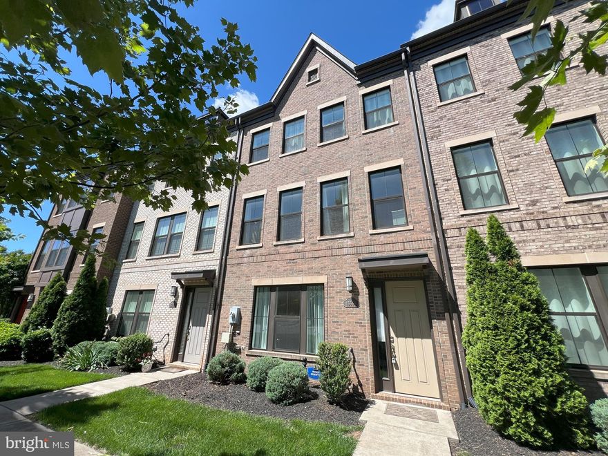Contemporary , Spacious, 4 Level Brick Front Townhouse is sought after Discovery Square community, with 5 Bedrooms, 4 and Half Bath, 2 Car Garage, Balcony & Roof Terrace.  Top highlights, Location, 5 Bedrooms, 4 Baths, Open Floor Plan on Main Level. As you enter the Lower Level/Basement Main Door, it has the 5th Bedroom with Full Bath & access to the Mudroom, 2 Car Backloading Garage.  The Main Level features Hardwood floors throughout, with a Spacious Living Room, Fireplace and access to the Balcony. The Gourmet Island Kitchen has ample storage, Pantry, Granite Counters, Stainless Steel appliances, Gas cooking and breakfast nook. The Dining Area is across from the kitchen. There is a half bath on this level. The third or Upper Level has Spacious Bedrooms with carpeted flooring and ceiling fans in all bedrooms. The Spacious Master Bedroom has ample storage in Master closet and a Double sink, Shower Master Bath. The two other bedrooms have a Shared Bath, plus the Laundry is on this Bedroom Level. The top floor or 4th Floor, has another Bedroom with Full Bath, plus you step out to Your own Huge Private Terrace, for entertaining Guests or enjoying the sunsets. Located close to Fairfax County Pkwy, Sully/Rt 28, Centreville Road, Dulles International Airport, Shopping, Grocery, Restaurants, in and around Herndon. Long & Foster Realtors Online Rental application only to apply.