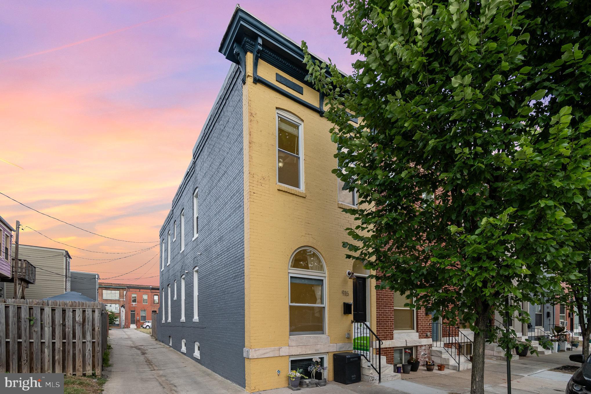 This stunning end-of-group rowhome has 5 years left on Baltimore City's CHAP credit and was renovated in 2020 and 2023. The home features new flooring throughout, upgraded lighting, and stainless steel appliances. The primary suite offers an en suite bathroom and a deck off the back. A new laundry room is conveniently installed on the bedroom level. The kitchen is equipped with quartz counters, and the entire house has been freshly painted. With 4 bedrooms and 3 bathrooms, this home also includes upgraded windows, NEW HVAC in 2025, recessed lighting, and a finished lower level. The perfect configuration makes it a great investment or roommate option, with two bedrooms and two baths upstairs and two bedrooms and a full bath in the lower level. Conveniently located near Johns Hopkins Hospital, local shops, and restaurants, this property offers both comfort and convenience. Enjoy the vibrant neighborhood with nearby parks and excellent public transport links. Don't miss this exceptional opportunity! Owner will also consider a lease, terms apply. Reach out to agent for details.