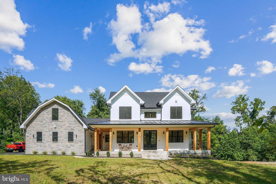 You're invited to an exclusive Builder’s Open House!

More Opportunities Available!
While the featured home is under contract, we have other stunning properties coming soon. Whether you have a lot in mind or need assistance finding the perfect one, DOMUM Construction will work with you to bring your dream home to life.  Meet directly with the builders to discuss custom home builds on your lot or ours.

 Welcome to 6642 Grays Mill Road, a luxury residence thoughtfully designed for modern comfort and convenience. Ideally located on the DC side of Warrenton, this property boasts premium features inside and out, creating an unparalleled sanctuary for sophisticated living.


Exterior Elegance: The home is graced with a wrap-around covered porch, featuring cedar-wrapped columns and a tongue-and-groove cedar ceiling. The roof pairs architectural shingles with a metal porch roof, combining functionality with aesthetic appeal. Buried gutter drains efficiently channel water away from the foundation, ensuring long-term protection. The exterior showcases a timeless combination of vinyl board and batten siding with natural stone veneer, offering a striking curb appeal. The spacious 3-car side-load garage is equipped with wood grain doors, attic access, and a 220V charging station for electric vehicles. A sidewalk leads to a rear deck, perfect for relaxing or entertaining outdoors.


Grand Interior: Enter through the impressive 8 ft double doors into a grand foyer illuminated by a stunning 40-inch chandelier. The Formal Dining Room and Living Room feature box tray ceilings, ambient LED lighting, and sophisticated chandeliers and recessed lights, creating a cohesive and elegant atmosphere. The Great Room is highlighted by an electric fireplace with a stone surround and custom wood mantle. Arched niches and built-in shelves flank the fireplace, adding style and storage. Bi-fold sliding doors open to reveal a 12ft x 18ft covered deck, seamlessly blending indoor and outdoor living with a tongue-and-groove cedar ceiling, ceiling fan, and recessed lighting.


Gourmet Kitchen: A chef's dream, the gourmet kitchen features a large 4ft x 7ft center waterfall island with storage on both sides, premium Idillio Quartz countertops, a subway tile backsplash, under-cabinet lighting, Café Energy Star appliances, floor-to-ceiling soft-close cabinets with champagne bronze hardware, a custom range hood, pot-filler, farmhouse sink, and a hidden door pantry with appliance storage. A butler's pantry leading to the formal dining area includes a sink and mini fridge to enhance the home’s entertaining functionality.


Upstairs Retreat: The upper level hosts a convenient laundry room and four spacious bedrooms, each equipped with a ceiling fan, bathroom access, and a data drop for hardwired connections. The stylish bathrooms feature porcelain floor tiles and quartz-top vanities. The primary suite is a luxurious retreat, boasting a custom-built walk-in closet, box tray ceilings with LED ambient lighting, and a stunning primary bathroom. The bathroom features an oversized shower with 2x4 porcelain tile, double shower heads, a rain shower, and body sprayers. A separate soaking tub area and a double vanity with built-in power outlets offer convenience and luxury, while a make-up vanity with an LED lighted mirror completes the suite.


Finished Walk-Out Basement: The fully finished walk-out basement is filled with natural light and includes a kitchenette with ample cabinets and premium Ice White Quartz counters, making it ideal for either entertaining or a separate living space. The full bathroom on this level features a large shower with large porcelain tiles. The Rec Room provides space for gatherings, while a Bonus Room behind barn doors offers versatile options for a home office, library, craft room, or entertainment space. Recessed lighting throughout keeps this level bright, and under-stair storage adds additional utility.