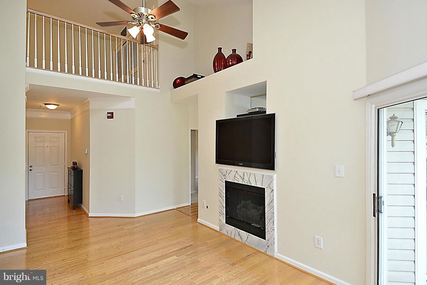 SELLER SAYS SELL! Spacious home w/ 2 large bedrooms located on main level + a relaxing loft space!  2 balconies perfect for some coffee and R&R. Gleaming wood floors on the main level. Other upgrades include: Vaulted ceilings, skylight, gas FPL,stainless steel kitchen appliances, designer lighting, newer HVAC, W/D & ceiling fans. Short walk to the lake and all the Kingstowne shops & restaurants.