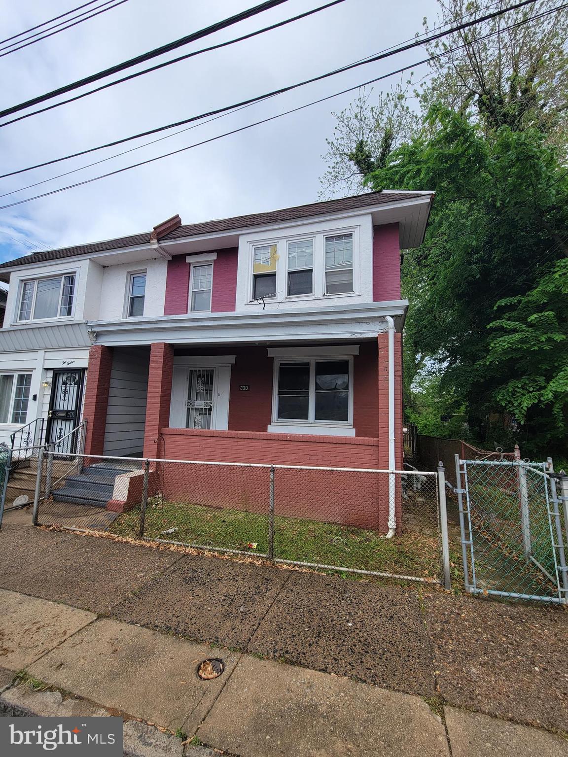 Great 4 bedroom 1.5 bath twin with large fenced in yard and deck! Covered front porch, hardwoods and carpeting throughout, updated kitchen, 4 bedrooms on 2nd level. Being sold in as-is condition.