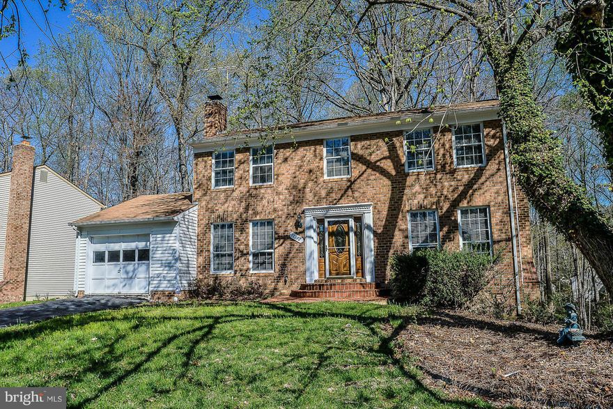 MOVE IN READY!!! Don t miss this lovely brick front colonial in heart of Lake Ridge.  Fully finished 3 levels w/ 5BR &3.5BA.  This home has it all- great kitchen, family rm w/fpl,  oversized Laundry rm, LL Rec room & 2 den rm that can used as BRs. Enjoy the seasons on the deck overlooking lush woods. Close to commuter routes, shopping and comm. amenities
