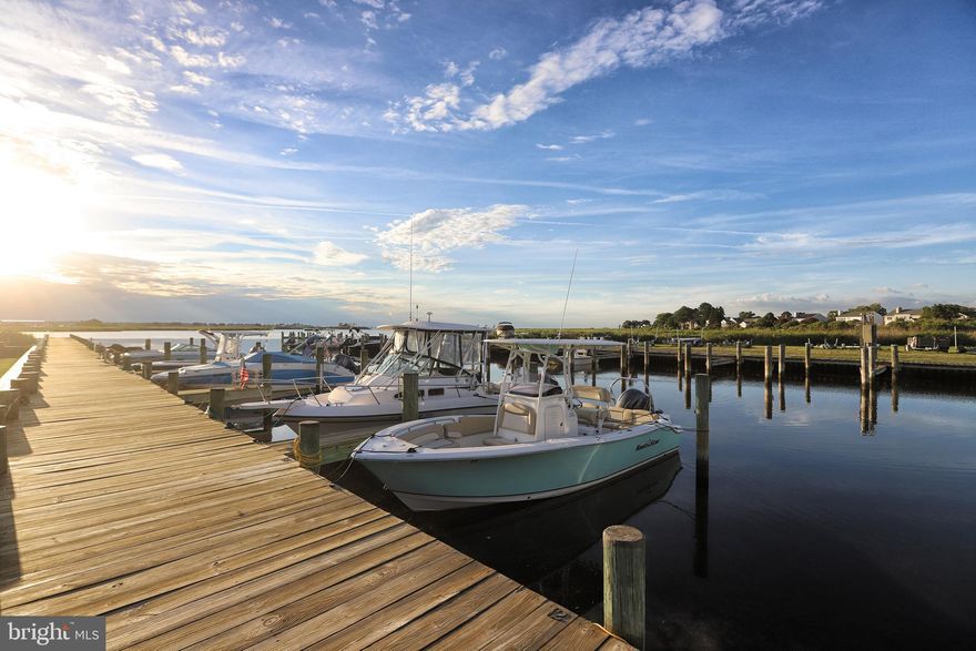 The Bayview at Kent Narrows offers a small community feeling with first class ammenities. Located at the edge of the Chester River, a nice breeze brings a sense of relaxation as you enjoy waterfront living at its finest. Gather on your large deck overlooking the marina and the Chester River, get in your brand NEW hottub ($18,000),  tale a stroll to the Kent Island Trail to the Kent Narrows, where you will find dining or hop on your boat and cruise the many waterways of the Chesapeake.
With over 2000 square feet of coastal living and waterviews from nearly every room, 113 Bayview is a highly desirable end unit featuring two stories of waterfront living.  The open floor plan on the lower level features hardwood floors throughout the kitchen, dining room, breakfast room, and the sunken great room. The second floor has pine wood floors and features a large owners suite. The newly renovated ensuite bath features a large spa like walk-in shower, and a walk-in closet. There is also a large second bedroom and second full bath, laundry room and a spacious loft which acts as a study, office, or your own private gym or yoga studio. 
This unit also includes a one car garage, first floor bath, wood burning fireplace, open floor plan and a large wrap around porch featuring  shade trees for those afternoon summer gatherings. Bayview also offers a deeded boat slip with water and electric for all owners, crabbing and fishing pier, community pool, secured boat storage, waterfront gazebo, full landscaping and snow removal, master insurance policy, water, Hardi Plank siding and direct access to the famour Cross Island Trail. 
Bayview is just a quick boat ride- from your own slip- to Kent Narrows, Annapolis, St. Micahels, Rock Hall and Cambridge! Close to restaurants, shopping and everything that the Eastern Shore has to offer.
Coastal waterfront living without the waterfront price, this highly sought after end unit will not last long. Welcome Home!