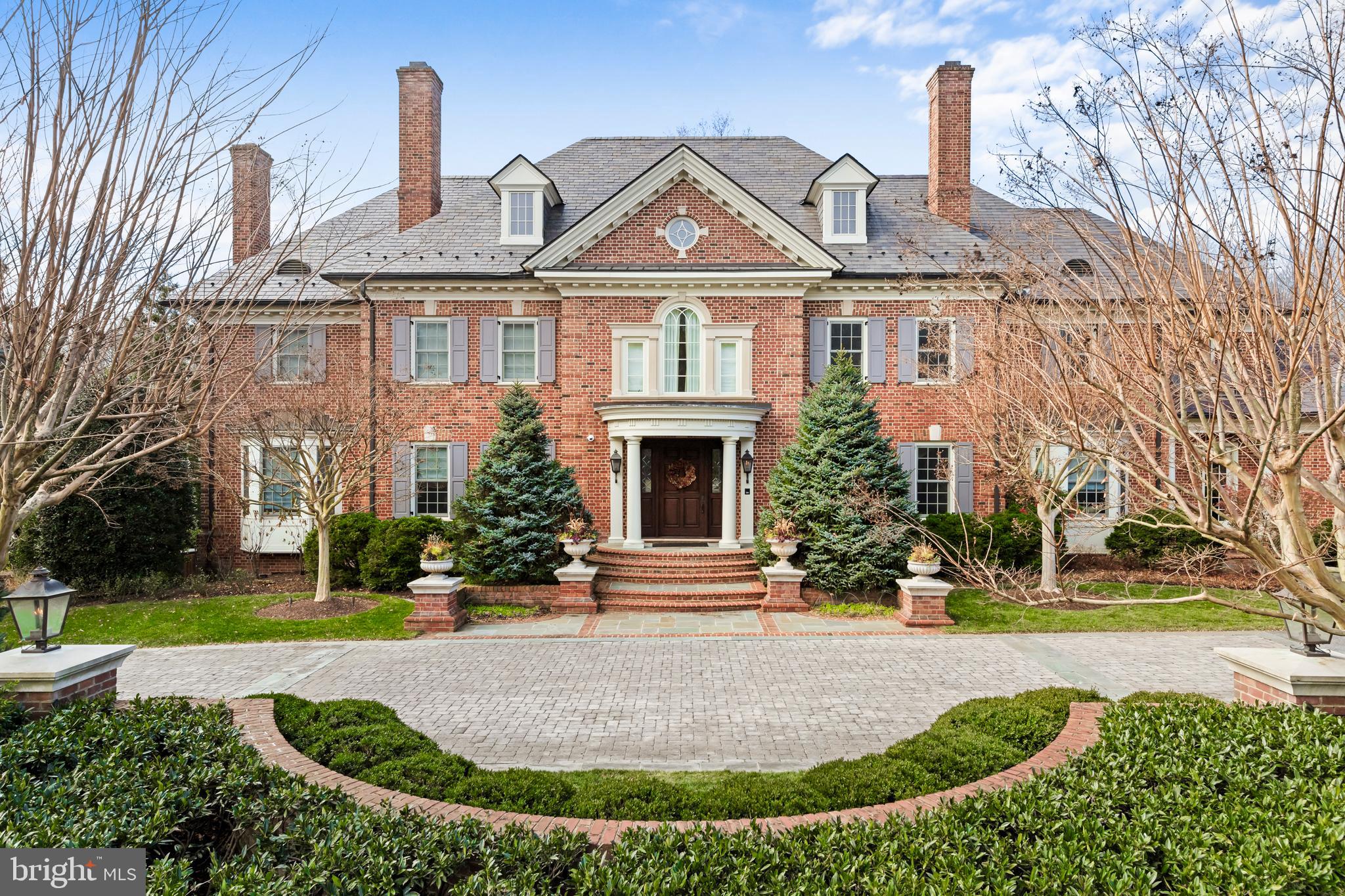 This extraordinary custom-built estate, designed by the acclaimed architect Glen Foong, is a testament to unparalleled craftsmanship and sophisticated design. Encompassing over 15,500 square feet of living space, this eight-bedroom, nine-full-and-two-half-bath residence seamlessly blends old-world elegance with modern luxury. The journey begins in the grand foyer, where walnut hardwood floors and discreetly integrated closets set a tone of understated opulence. The living room and library, adorned with fireplaces and doors sourced from a 500-year-old Loire Valley villa, exude timeless charm. Oversized windows, designer tile accents, and custom window treatments invite natural light to dance throughout the home, creating an ambiance of serene refinement. At the heart of the residence lies a gourmet kitchen that rivals any chef’s dream. Michelangelo marble countertops imported from Carrara, Italy, elevate the space, complemented by a 60-inch Wolf range with double ovens, dual Sub-Zero appliances, and a Miele steamer. A cozy breakfast area, complete with a Georgian-style coffee banquette and TV lounge, provides the perfect space for casual mornings, while the butler’s pantry leads seamlessly to a banquet-sized dining room designed for grand entertaining. The adjacent, sun-drenched great room offers a seamless blend of comfort and sophistication, with a timeless stone fireplace adding warmth and ambiance. The upper level is a sanctuary of comfort, anchored by a spa-like primary suite featuring a serene sitting area, an expansive walk-in closet, dual water closets, and a steam shower. Five additional bedrooms, thoughtfully designed to accommodate family and guests, include a nursery or office option and a central lounge area. A second laundry room with dual washers and dryers ensuring effortless practicality. The lower level transforms into an entertainer’s dream, offering a state-of-the-art theater, a fully equipped gym with a sauna, a wine cellar, and a recreation area with a kitchenette. Two guest en-suites with privacy and convenience for extended stays. This estate is meticulously appointed with modern conveniences, including a custom iron staircase, an elevator, a four-car garage, a central vacuum system, and a commercial grade whole-house generator. The neighborhood boasts pristine sidewalks, offering a perfect blend of walkability and timeless appeal. Nestled in a prime location, this neighborhood offers unparalleled convenience. Residents enjoy close proximity to the prestigious Congressional Country Club, renowned for its world-class golf courses and amenities. Just minutes away lies downtown Bethesda, a vibrant hub celebrated for its diverse dining options, upscale boutiques, and rich cultural scene.
Additionally, the nation's capital, Washington, D.C., with its historic landmarks and museums, is easily accessible, providing a perfect blend of suburban tranquility and urban excitement.