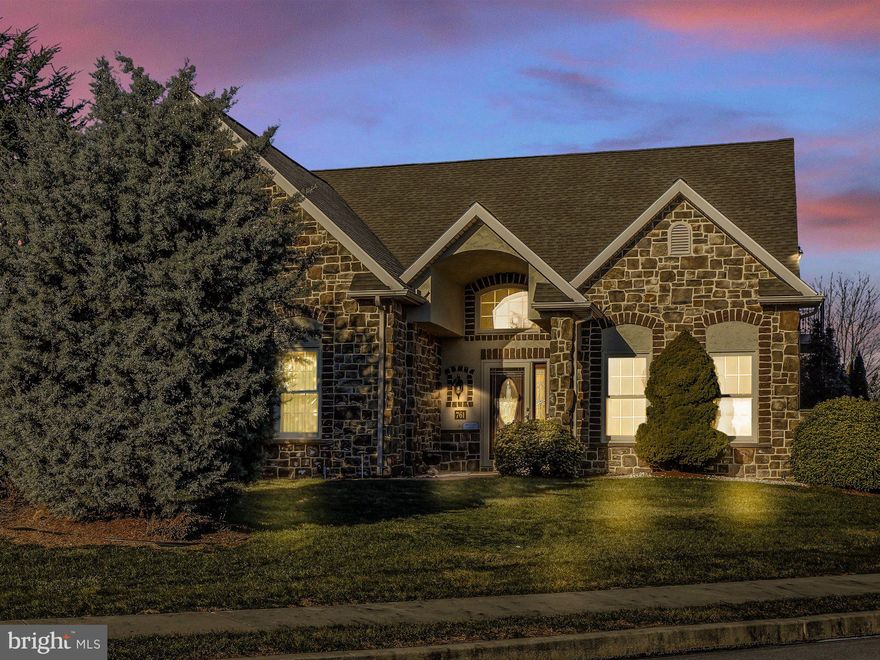 Beautiful 3-4 bedroom custom home in Brookshire's 55+ community, designed for comfortable entertaining. From the stunning covered front porch, enter into a grand entrance way open to the 2nd floor walkway.  There is a formal dining room to your right, straight ahead is a curved stone half-wall separating the huge eat in kitchen from the hallway. On your left is the the door to the oversized 2 car garage (with the on-demand gas hot water heater), large storage closet with the tools for the centract vac system and water softener, coat closet, storage closet and laundry room. Walk into the large living room with a cathedral ceiling, lots of windows and a double sided gas fireplace shared with the large sunroom which has a door to the covered, stamped concrete and stone pillared patio.  The large main bedroom also has a ceiling fan, large walk in closet, and an elegant bathroom, complete with a double bowl sink, sitting area, shower, and stone soaking tub.  Completing this floor is a bedroom/office with lots of closet space and a half bath off the living room. Upstairs are 3 rooms, perfect for an in-law suite or comfortable quarters for long term guests.  There is one large bedroom with a walk in closet, a second smaller bedroom, both across the hall from the 2nd full bathroom, Down the hallway, open to the entranceway is another large room with access to the balcony.  This room could be a workout room, 4th bedroom or just a family room or office. Originally it was a beauty salon and sitting area, but the current owner removed the sink (but the water lines are still there.). this room has a nice closet and some storage in the eaves. If you ever dreamed of owning a castle, this stone home comes close!