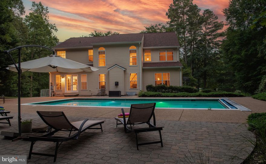 ✨ Back on the Market! ✨
This stately stone-front former model home sits on a landscaped 1.05-acre lot with a sparkling saltwater pool. Step inside to an elegant two-story foyer with hardwood floors, 9+ ft ceilings, and formal living and dining rooms with crown molding and chair rail. The dramatic two-story family room features expansive windows and a cozy propane fireplace, flowing into the beautifully renovated 2022 kitchen with granite counters, oversized island, soft-close cabinets, prep sink, walk-in pantry, and energy-efficient appliances.
The main level also offers a full bath and private office overlooking the pool. Upstairs, the vaulted-ceiling primary suite boasts a spa-like bath with soaking tub, dual vanities, and a large walk-in closet. Three additional bedrooms, hall bath, and a laundry room complete the upper level.
The finished walk-out basement provides two bedrooms, a full bath, sauna (as-is), storage, washer/dryer hookup, and access to the side yard. Bonus: the double doors in the basement are newly installed! Fresh updates include a pumped septic system with new risers. HSA Premium package is included! Contact me for more details!