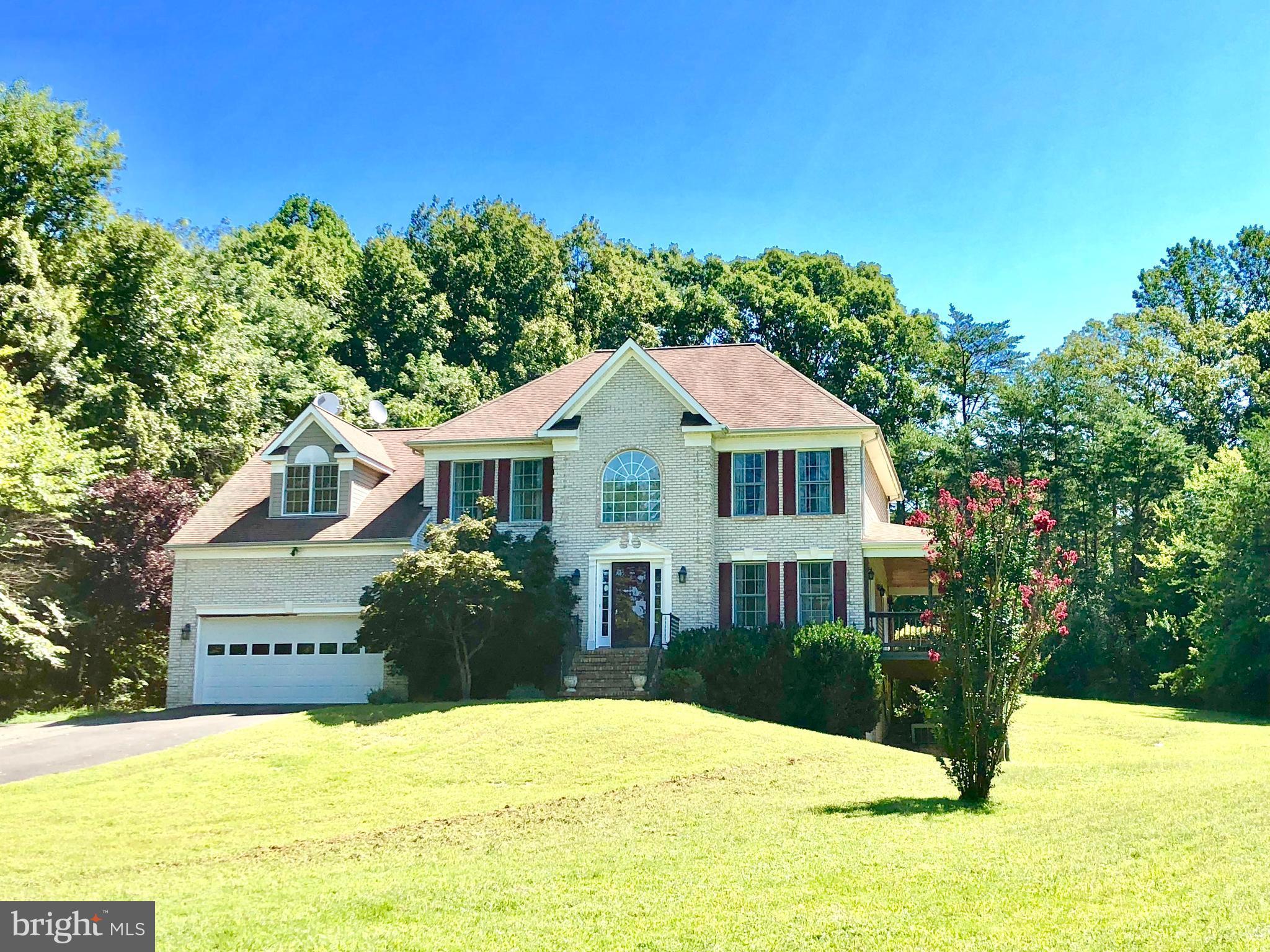 Welcome to 31 Willowmere Court in Stafford, Virginia — an elegant retreat nestled on over three serene acres, offering the perfect blend of privacy, luxury, and convenience. This beautifully maintained home features five bedrooms and four and a half baths across more than 4,500 square feet of living space. Inside, you’ll find gracious formal living and dining rooms, a comfortable family room, a dedicated home office, and a chef’s kitchen with upgraded countertops, abundant cabinetry, and a sunny breakfast area. The spacious master suite is a true retreat with a spa-style bath featuring a jetted tub, dual vanities, separate shower, and a generous walk-in closet. Throughout the home, elegant hardwood floors, custom trim, and built-in cabinetry add warmth and sophistication.
The fully finished lower level extends your living space with hardwood floors, a wet bar, and a large recreation room perfect for entertaining, movie nights, or relaxation. A bonus fifth bedroom or flex room and additional full bath complete this level. A two-car garage provides direct access and extra storage. Outdoors, enjoy the tranquility of the expansive 3.169-acre lot featuring mature landscaping, a rear deck overlooking scenic grounds, a covered verandah ideal for morning coffee, and a flagstone patio with a built-in firepit for evenings under the stars. The property also includes a garden shed and sits on a quiet cul-de-sac offering extra privacy. Pets are considered on a case-by-case basis.
Located in the sought-after Mountain View school district, this home offers the perfect balance of countryside peace and commuter convenience. Major routes including I-95 and Route 610 are easily accessible, and the Leeland Road VRE station provides direct rail service to Washington, D.C. Nearby major employers include Marine Corps Base Quantico, the FBI Academy and Crime Lab, and a growing number of defense, security, and technology firms supporting Stafford’s thriving economy.
The area surrounding Willowmere Court is rich in history, culture, and outdoor recreation. Residents can explore local landmarks like Chatham Manor, George Washington’s Ferry Farm, and Stafford Civil War Park, or enjoy the trails and waterfront views at Government Island and Widewater State Park. Aquia Landing Park offers riverside recreation, swimming, and picnicking, while Potomac Point Winery, local breweries, and community festivals add to Stafford’s vibrant lifestyle. Downtown Stafford offers charming shops, restaurants, and year-round cultural events.
This home provides an exceptional opportunity of living in one of Stafford’s most picturesque settings, with convenient access to regional employers, schools, and attractions.