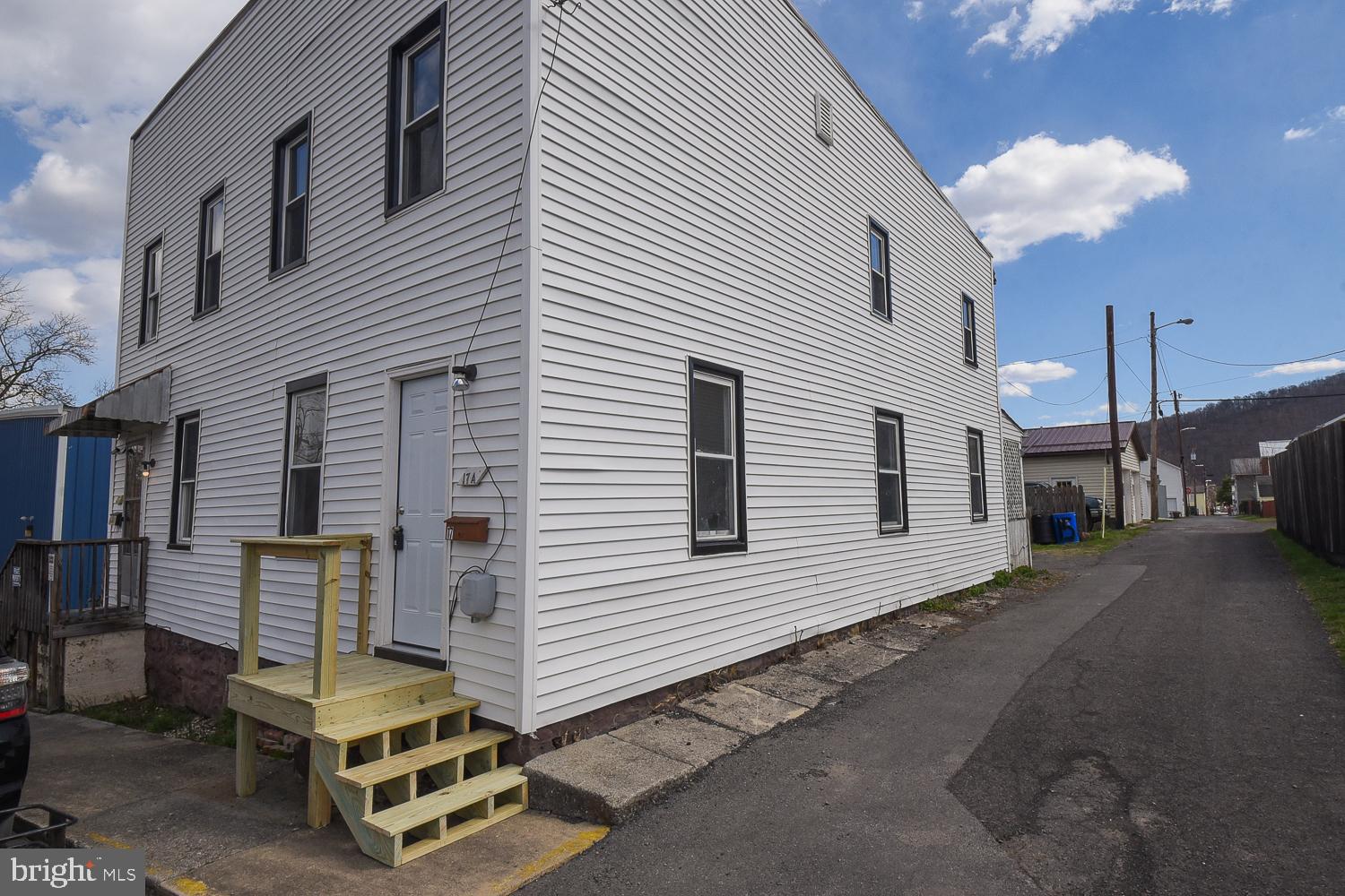 Great investment opportunity in the heart of Keyser. Left side (15 A) is occupied/rented by long term tenant. Right side (17A) was just recently remodeled and is shown in the photos.