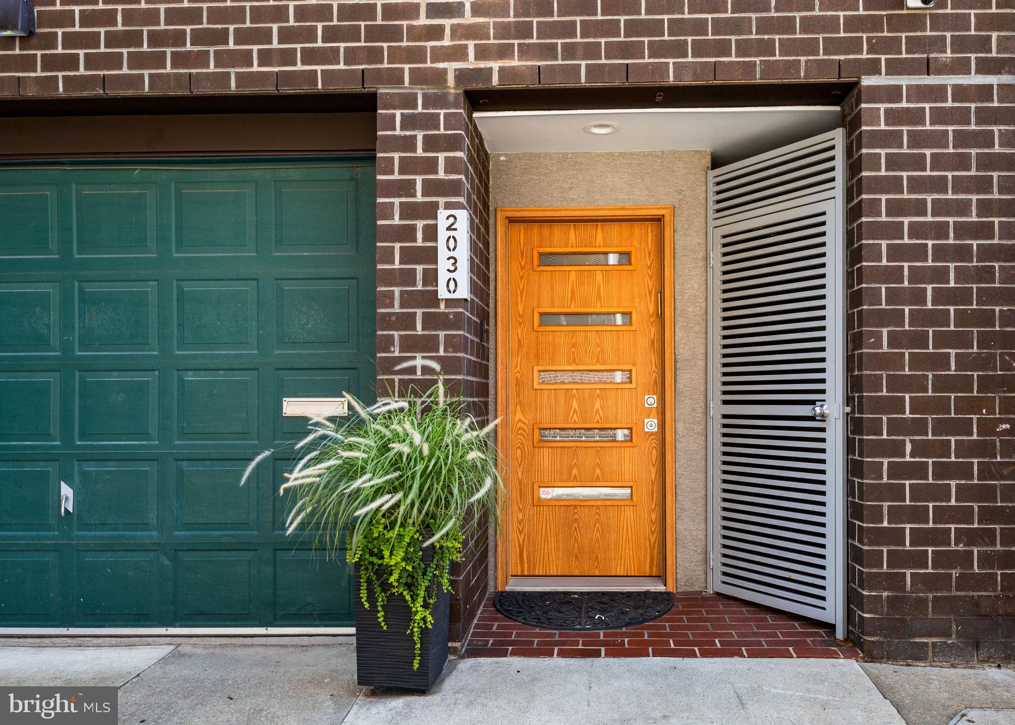 Welcome to 2030 Ranstead Street, where historical elegance merges seamlessly with modern luxury in the vibrant heart of Center City. This exquisitely reimagined three-bedroom, three-and-a-half-bathroom home spans 2400 square feet, offering an open invitation to experience soaring ceilings, exposed beams, and original walnut pegged floors that beautifully echo Philadelphia’s architectural heritage. The living areas are gracefully anchored by a wood-burning fireplace, complemented by brand-new windows and fresh finishes, setting a sophisticated yet inviting scene for daily living.
The chef’s kitchen stands as the heart of the home, perfect for culinary enthusiasts and entertainers alike. It features a six-burner commercial-grade gas range, convection oven, a new French door refrigerator, and instant hot water with filtration, marrying functionality with style. The lower-level wine cellar adds a touch of sophistication, while a full-size laundry room with a gas dryer enhances everyday convenience.
Attention to detail is evident throughout, with a three-zone WiFi-enabled HVAC system featuring UV filtration, and a state-of-the-art life safety and security system equipped with cameras, a Ring doorbell, and whole-home surge protection. Newly updated electric, plumbing, water, sewer, and power lines offer peace of mind for years to come. A rare find in the city, the oversized, climate-controlled steel garage with an isolated door and slop sink offers exceptional parking and storage solutions.
The rooftop is your private urban oasis, complete with power, water, a kitchenette, and a freshly coated fiberglass deck, making it the ideal spot for morning coffee or evening gatherings. A remote-controlled skylight floods the living room below with natural light, seamlessly blending indoor and outdoor spaces.
Every aspect of 2030 Ranstead Street is crafted with precision, combining historic charm with modern amenities and the convenience of private parking, creating a home that is both practical and inspiring. This is more than just a residence; it's a lifestyle waiting to be embraced.