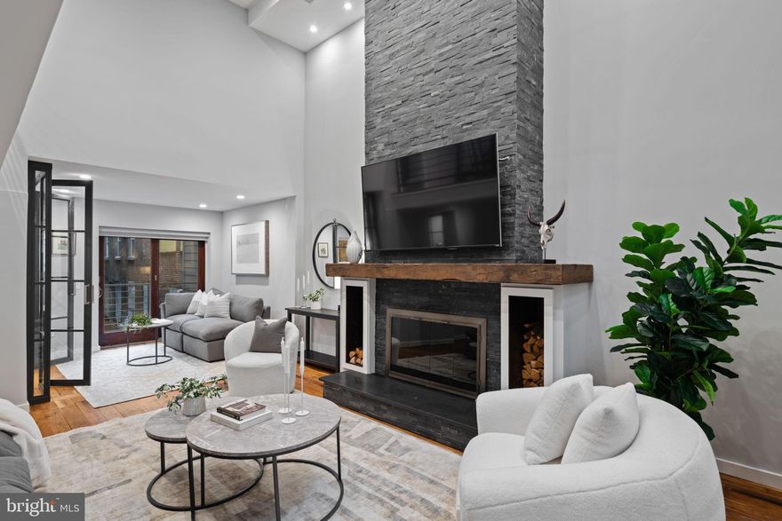 Welcome to 2030 Ranstead Street, where historical elegance merges seamlessly with modern luxury in the vibrant heart of Center City. This exquisitely reimagined three-bedroom, three-and-a-half-bathroom home spans 2400 square feet, offering an open invitation to experience soaring ceilings, exposed beams, and original walnut pegged floors that beautifully echo Philadelphia’s architectural heritage. The living areas are gracefully anchored by a wood-burning fireplace, complemented by brand-new windows and fresh finishes, setting a sophisticated yet inviting scene for daily living.

The chef’s kitchen stands as the heart of the home, perfect for culinary enthusiasts and entertainers alike. It features a six-burner commercial-grade gas range, convection oven, a new French door refrigerator, and instant hot water with filtration, marrying functionality with style. The lower-level wine cellar adds a touch of sophistication, while a full-size laundry room with a gas dryer enhances everyday convenience.

Attention to detail is evident throughout, with a three-zone WiFi-enabled HVAC system featuring UV filtration, and a state-of-the-art life safety and security system equipped with cameras, a Ring doorbell, and whole-home surge protection. Newly updated electric, plumbing, water, sewer, and power lines offer peace of mind for years to come. A rare find in the city, the oversized, climate-controlled steel garage with an isolated door and slop sink offers exceptional parking and storage solutions.

The rooftop is your private urban oasis, complete with power, water, a kitchenette, and a freshly coated fiberglass deck, making it the ideal spot for morning coffee or evening gatherings. A remote-controlled skylight floods the living room below with natural light, seamlessly blending indoor and outdoor spaces.

Every aspect of 2030 Ranstead Street is crafted with precision, combining historic charm with modern amenities and the convenience of private parking, creating a home that is both practical and inspiring. This is more than just a residence; it's a lifestyle waiting to be embraced.