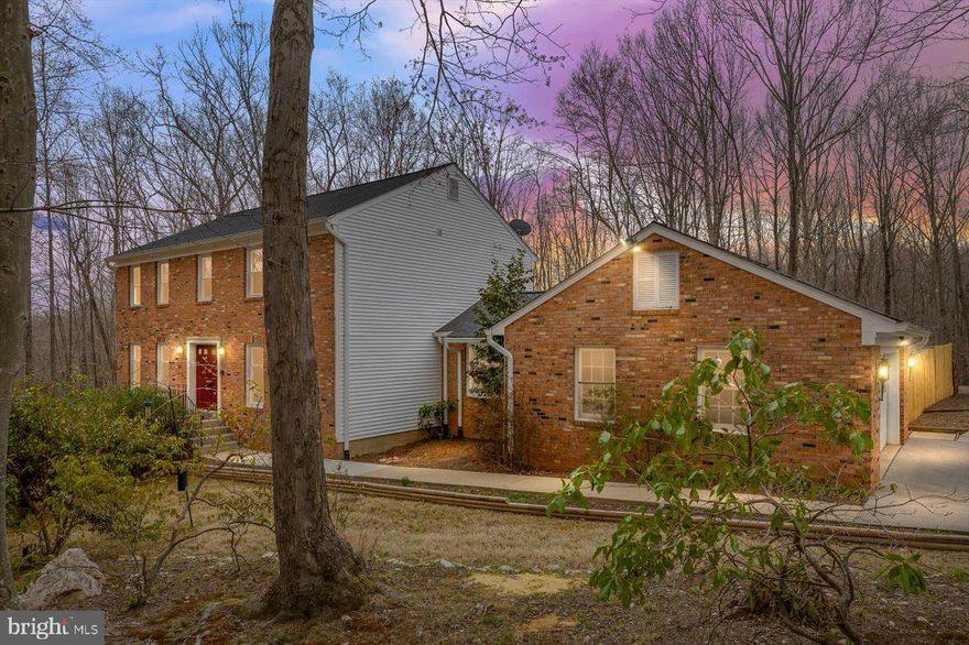 **Sunday 4/6/2025 Open House Postponed**Welcome to 4911 Stonehurst Dr, Woodbridge, VA 22192—a beautifully updated 4-bedroom, 2.5-bathroom home nestled on a 1.6+ acre wooded corner lot. Offering 3,300 finished sqft of living space, this home perfectly blends comfort, convenience, and outdoor luxury.  Step inside to find gleaming hardwood floors on the main level, a gorgeous brick fireplace, and fresh new carpet and paint throughout. The updated kitchen boasts stainless steel appliances and modern finishes, while the bright sunroom offers the perfect spot to relax with views of the backyard oasis.  Outside, enjoy resort-style living with a huge Trex deck leading to your very own personal inground pool and raised seating area! The massive privacy-fenced backyard is ideal for entertaining, while the 15x20 heated workshop with electricity provides endless possibilities for hobbies or storage.  Recent updates include a new roof, updated kitchen, and refreshed deck, ensuring peace of mind for years to come. Located just minutes from shopping, dining, and medical facilities, this home offers the perfect balance of seclusion and convenience.  Don’t miss this rare gem—schedule your tour today!