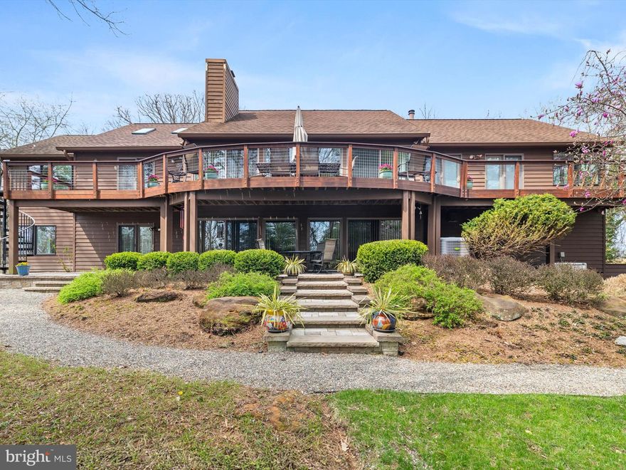 Discover this one-of-a-kind custom-built split foyer home, transformed into a contemporary masterpiece through an extensive remodel (2012-2015). Nestled on a private flag lot, this stunning 3,688 sq. ft. residence is perched on a scenic hilltop, offering seasonal winter water views of Deep Creek and the Magothy River. With exceptional craftsmanship, premium materials, and thoughtfully designed spaces, this home is a true retreat. Located in the desirable Shore Acres community offering an array of amenities, including a waterfront park, community beach, boat ramp, and playground. Enjoy a neighborhood with seasonal events, excellent schools, and convenient access to shopping, dining, and major commuting routes. Schedule your private showing today!