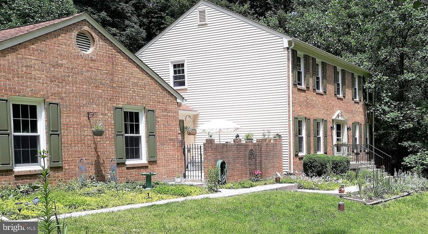 Tucked back in beautiful Woodbine Woods, this well-maintained 4 bedroom home has been updated throughout, including a gorgeous kitchen and baths.  Lovely hardwoods on main level and wood burning fireplace.  The cozy walkout lower level offers another wood burning fireplace. Situated on almost 2.5 wooded acres, you can fully enjoy your in-ground swimming pool in privacy and entertaining on the spacious, two-level deck with hot tub and indoor/outdoor audio system.  This is the one you have been waiting for!  Accepting offers until 3pm on Monday, June 22nd.