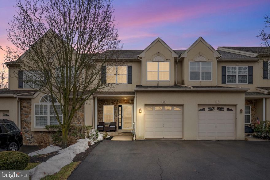 Join us for an open house Saturday March 14th, 12pm-2pm & Sunday March 15th 10am-12pm. 
Welcome to 52 Arbor Circle in Colmar, a meticulously maintained and thoughtfully upgraded 3-bedroom, 2.5-bath townhome with a 1-car garage and fully finished basement, offering over about 3,000 square feet of total living space across multiple levels. Located within the North Penn School District, this home combines spacious living areas, stylish finishes, and an exceptional layout designed for both everyday living and entertaining.
Step inside to a welcoming foyer with hardwood flooring and crown molding that opens into a bright and inviting main living area. The spacious living room features recessed lighting, hardwood floors, and a cozy fireplace that creates a warm focal point for the space. The open layout flows seamlessly into the dining area and kitchen, making it ideal for hosting family and friends.
The kitchen is well-appointed with granite countertops, stainless steel appliances, tile backsplash, abundant cabinetry, and a center island with seating, offering both style and functionality. A walk-in pantry provides excellent storage, while the adjacent dining area overlooks the rear of the home. Just beyond, a beautiful sunroom with vaulted ceilings and walls of windows fills the space with natural light and provides access to the rear deck. A convenient powder room and interior access to the garage with EV charger outlet complete the main level.
Upstairs, the spacious primary suite offers a comfortable retreat with plush carpeting, crown molding, and a large walk-in closet with built-in organization. The en-suite bathroom features vaulted ceilings, a soaking tub, double vanity, tile shower and large windows that bring in abundant natural light. Two additional bedrooms and a full hall bathroom provide plenty of space , while a second-floor laundry area adds everyday convenience.
The home also includes a large third-floor attic space currently used for storage, presenting an excellent opportunity for future expansion into additional living space such as a fourth bedroom, home office, playroom, or guest suite.
One of the standout features of the home is the fully finished basement, which dramatically expands the living and entertaining space. This level features a custom-built bar with seating, quartz countertops, ,and built-in shelving, creating the perfect setup for hosting gatherings or watching the big game. The bar area opens into a spacious recreation and lounge area centered around a stunning custom media wall with recessed LED accent lighting, ideal for movie nights or relaxing with family. Additional flexible space currently serves as a home gym and game area, offering endless possibilities for a fitness room, playroom, or additional living area.
Outdoor living is equally enjoyable with a rear deck overlooking a large open community green space, providing peaceful views and a great spot for outdoor dining, grilling, or morning coffee. The surrounding neighborhood features beautifully maintained common grounds and expansive lawn areas that create a park-like setting throughout the community.
Conveniently located near major commuter routes, shopping, dining, and SEPTA regional rail, this home offers the perfect combination of space, comfort, and accessibility in a highly desirable Montgomery County location. Schedule your showing today!